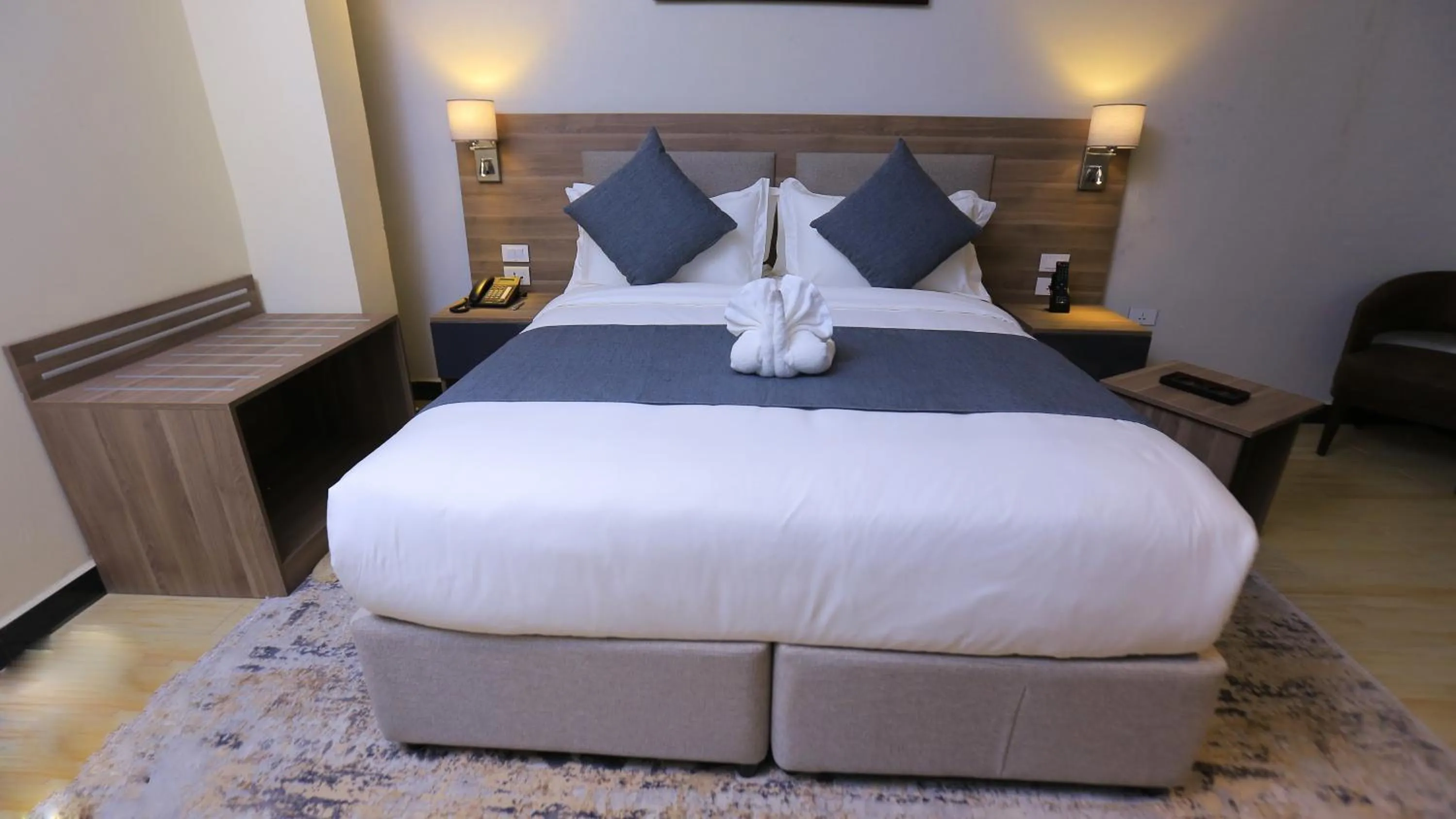 Bed in Triple E Hotel and Spa