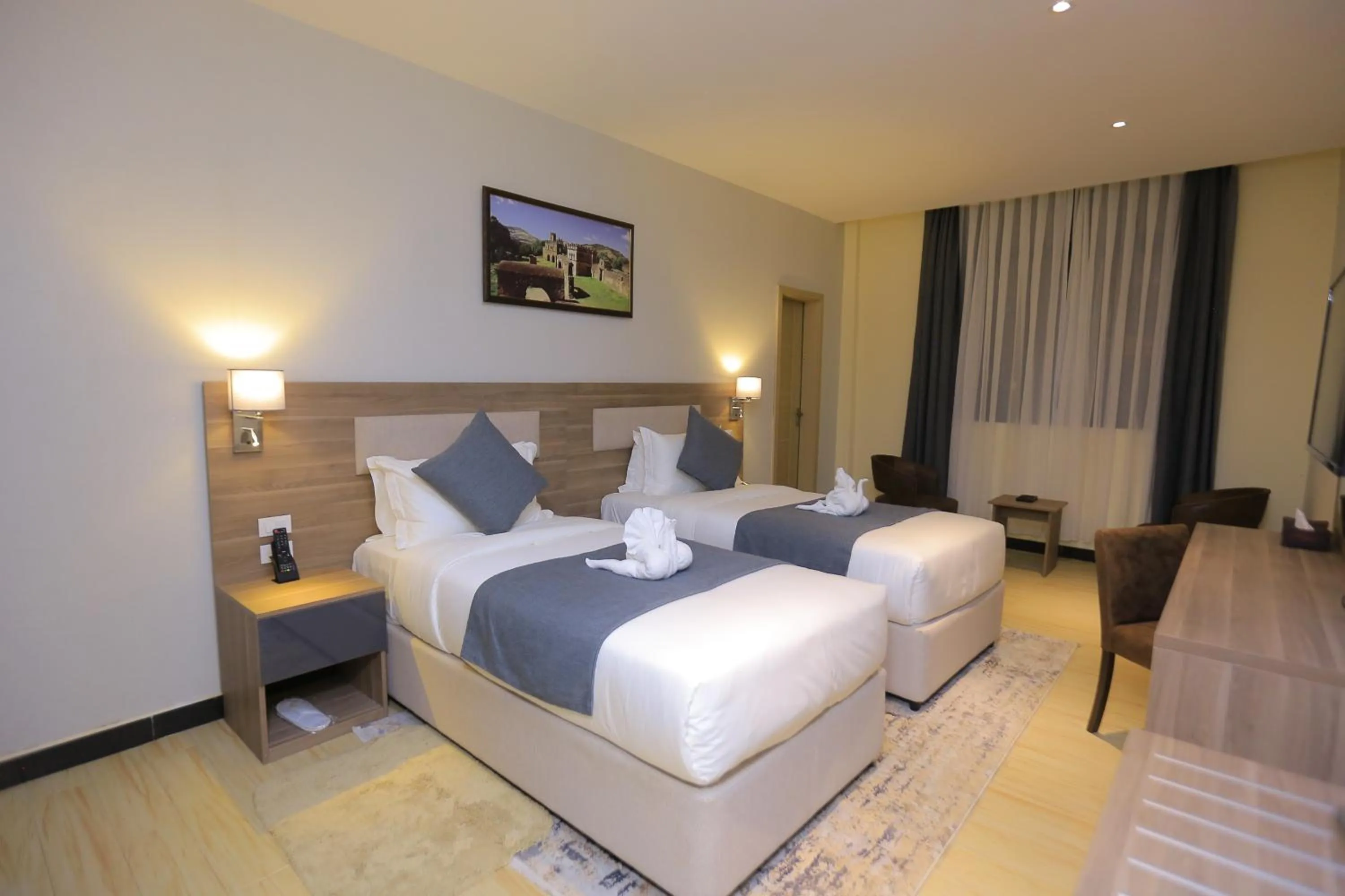 Bed in Triple E Hotel and Spa