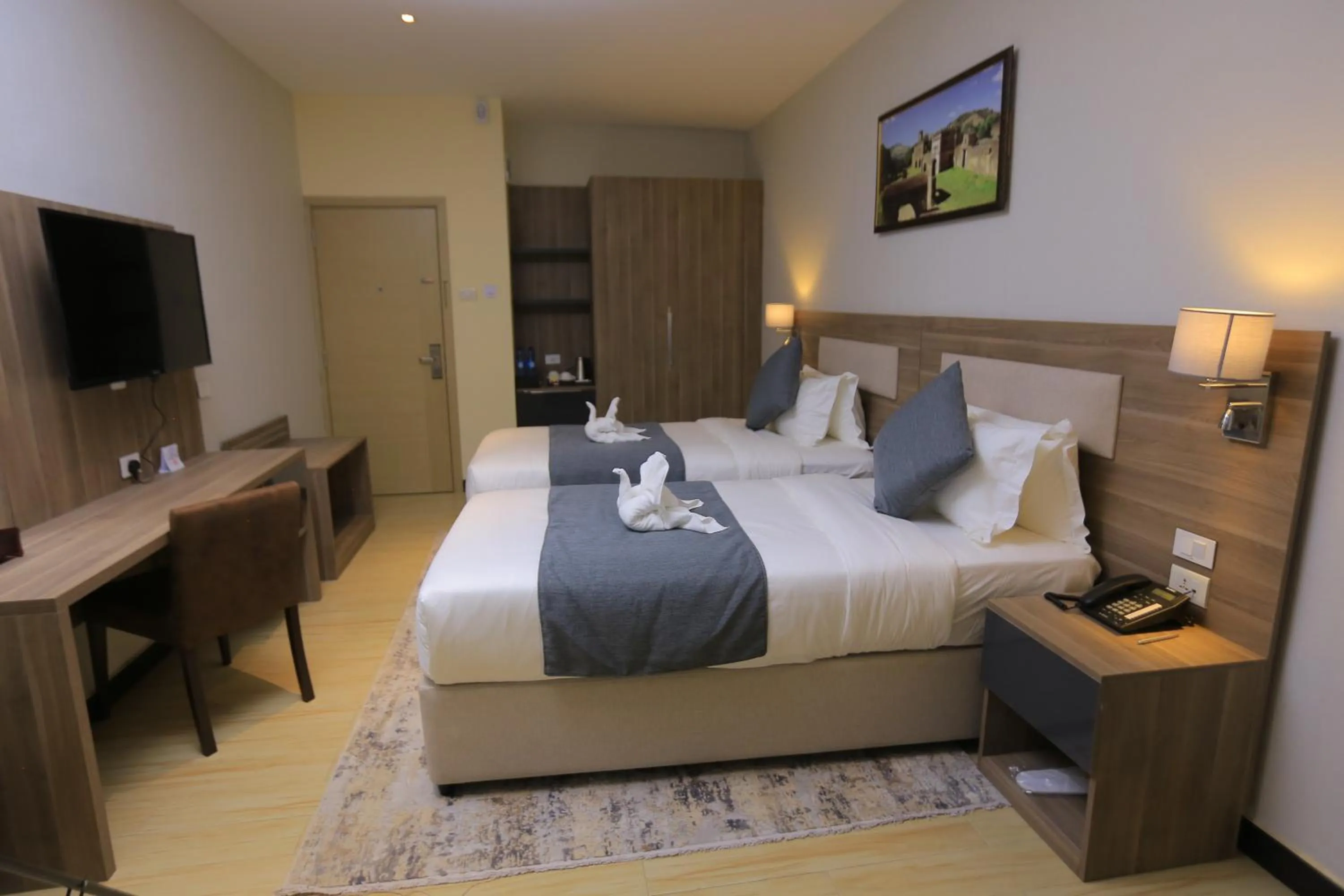 Bed in Triple E Hotel and Spa