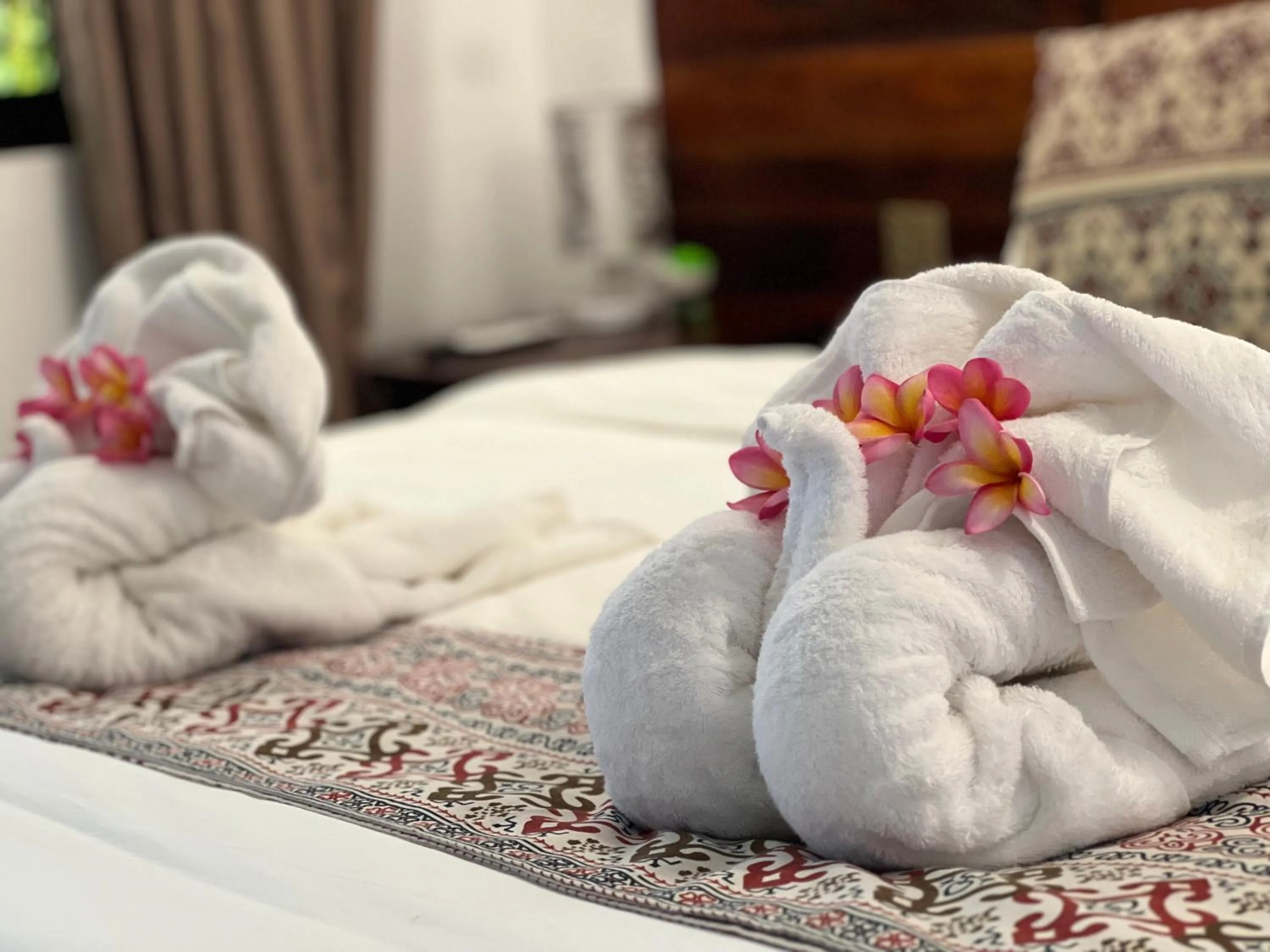 towels, Bed in Infinity Diving Resort and Residences