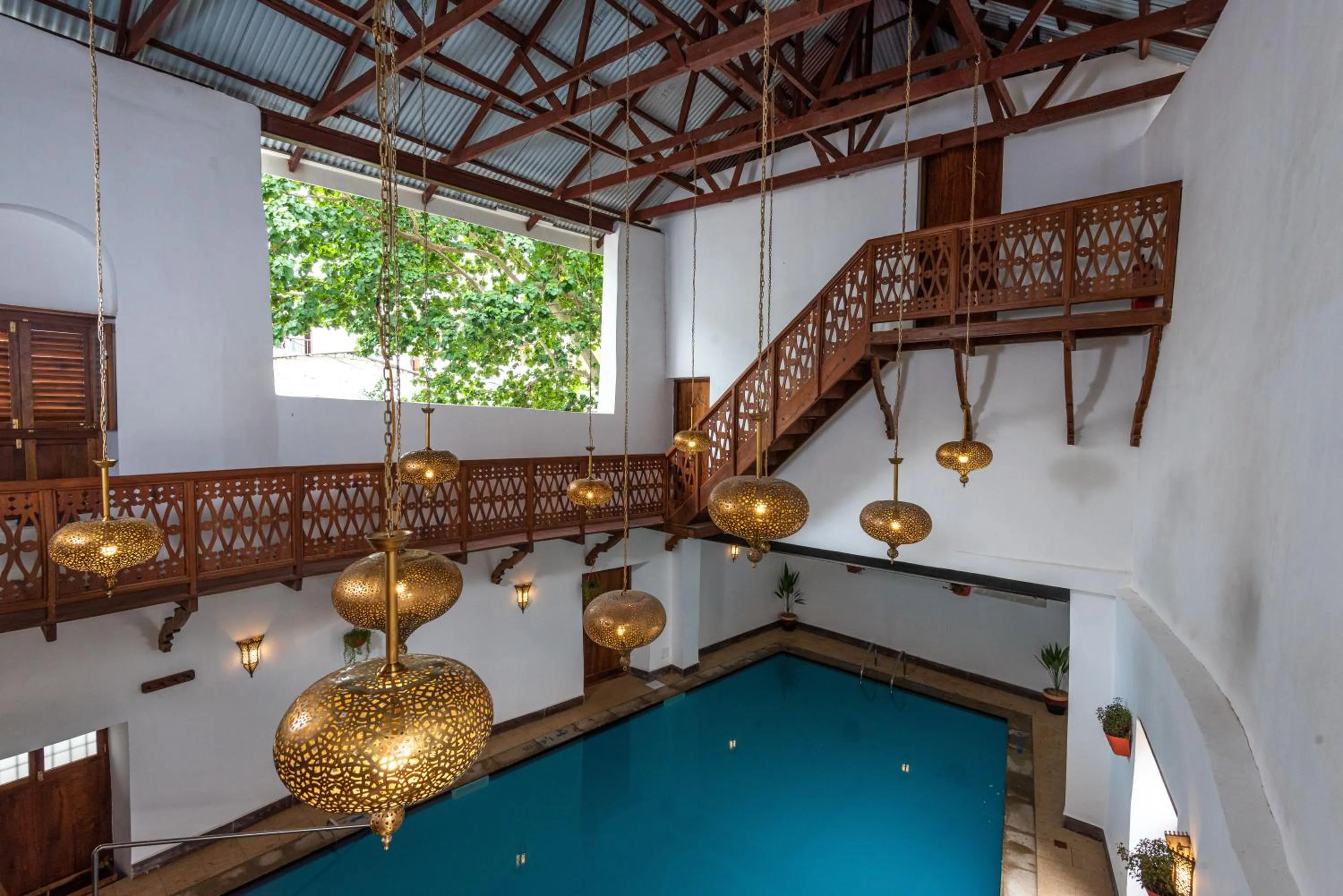 Swimming pool in Turaco Spice Tree, a Tribute Portfolio Hotel