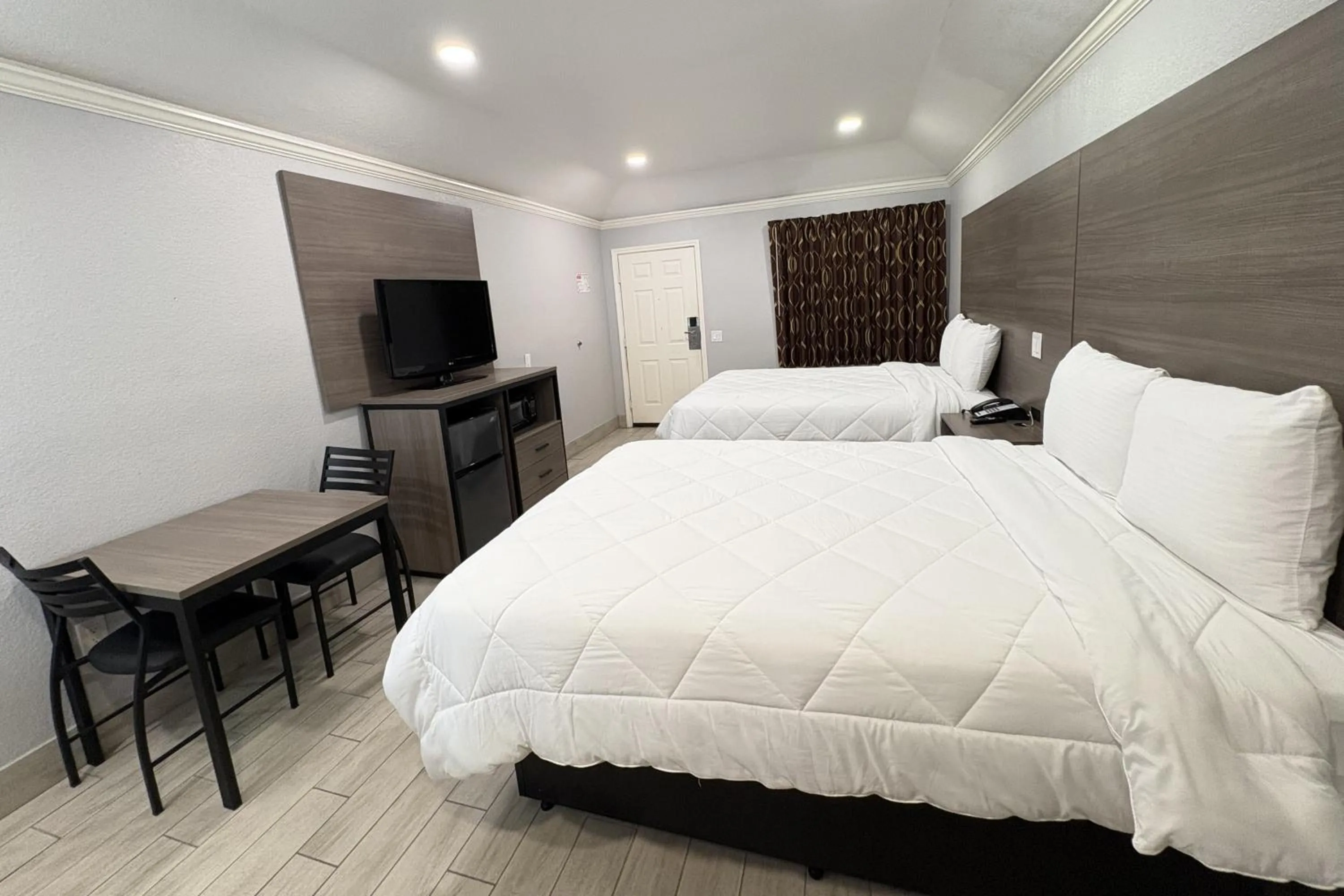 Bedroom, Bed in Kiwi Inn Capital O Houston - Hwy 249