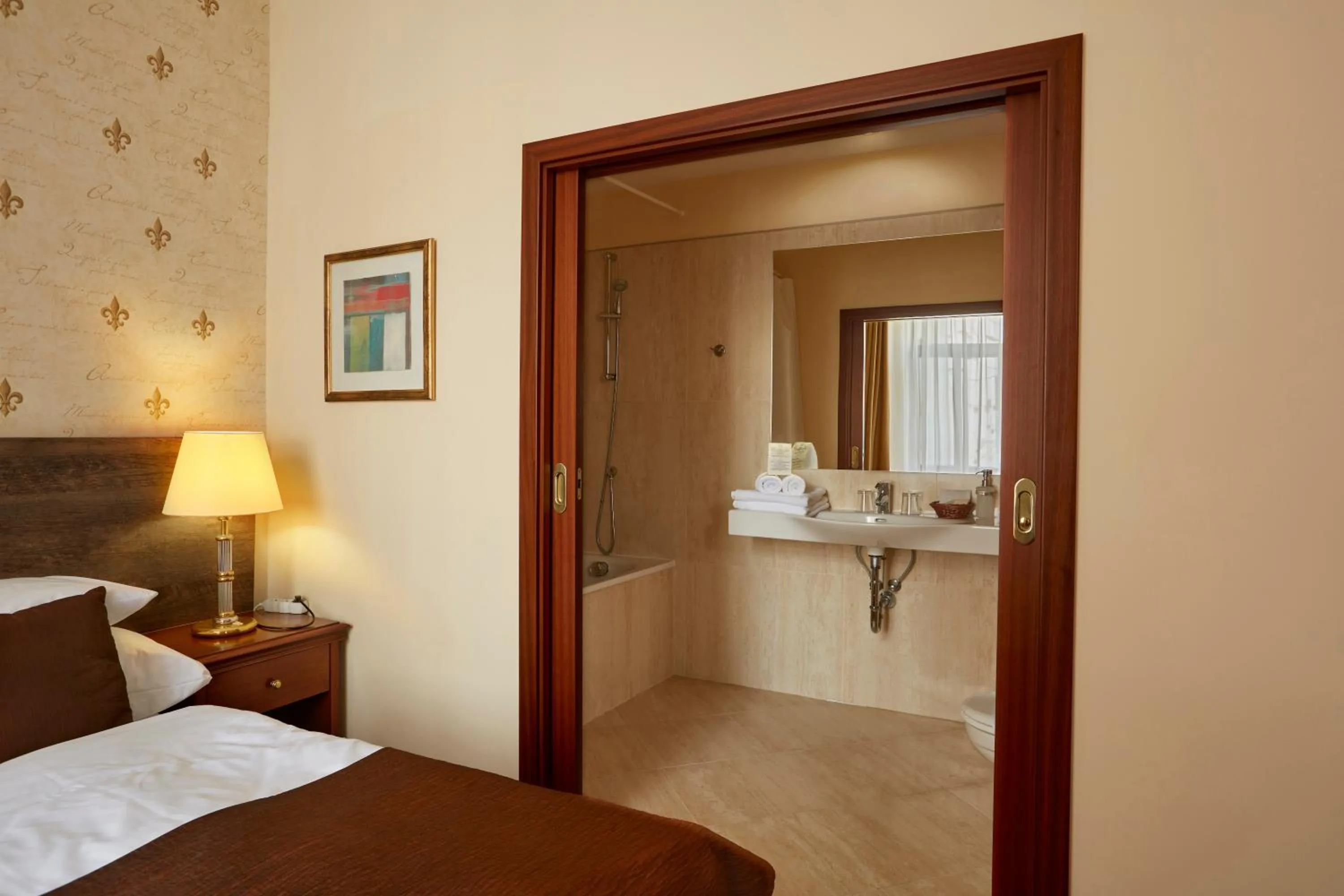 Bed in FLEUR DE LIS HOTEL