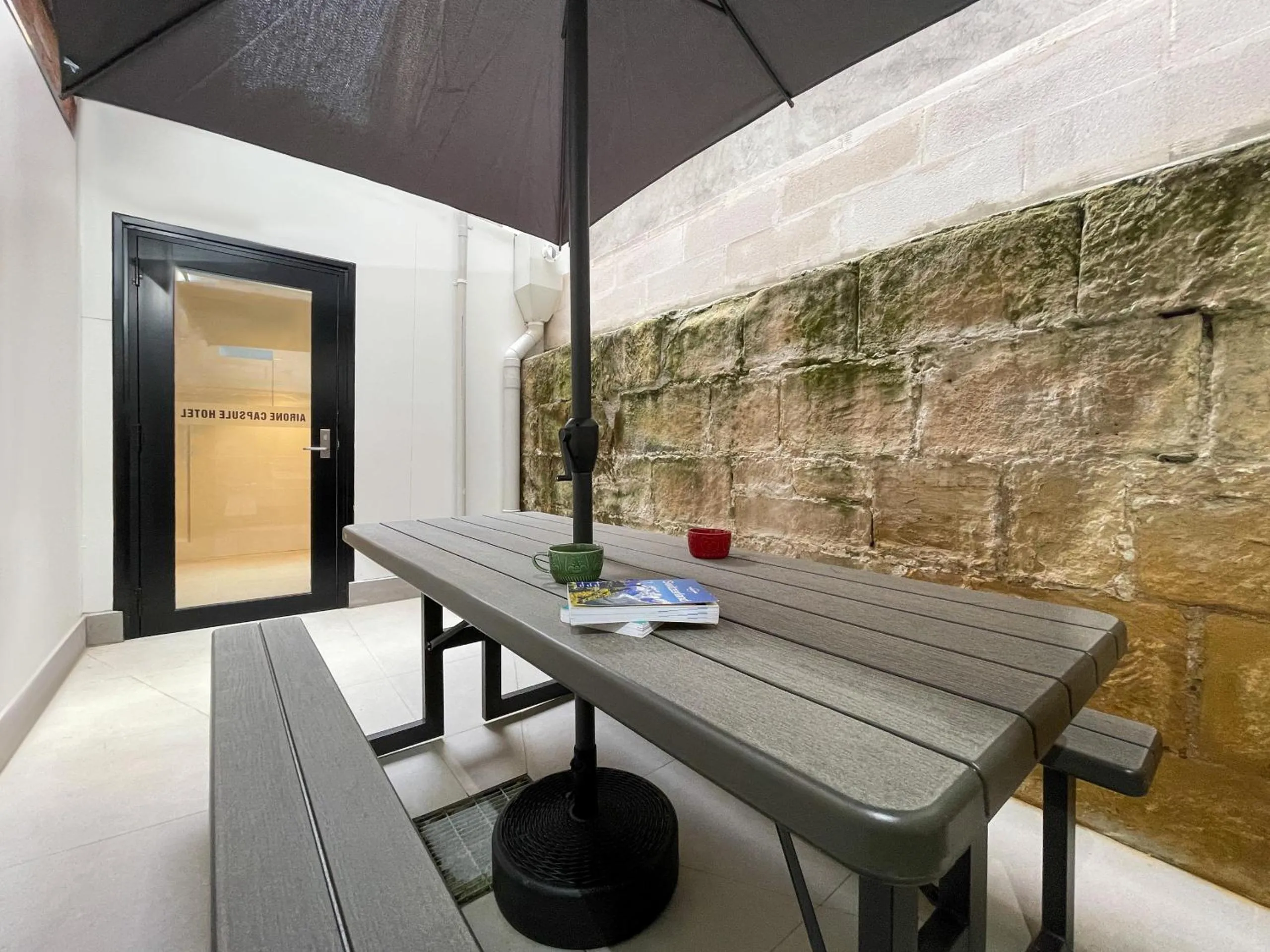Seating area in Airone Capsule Hotel