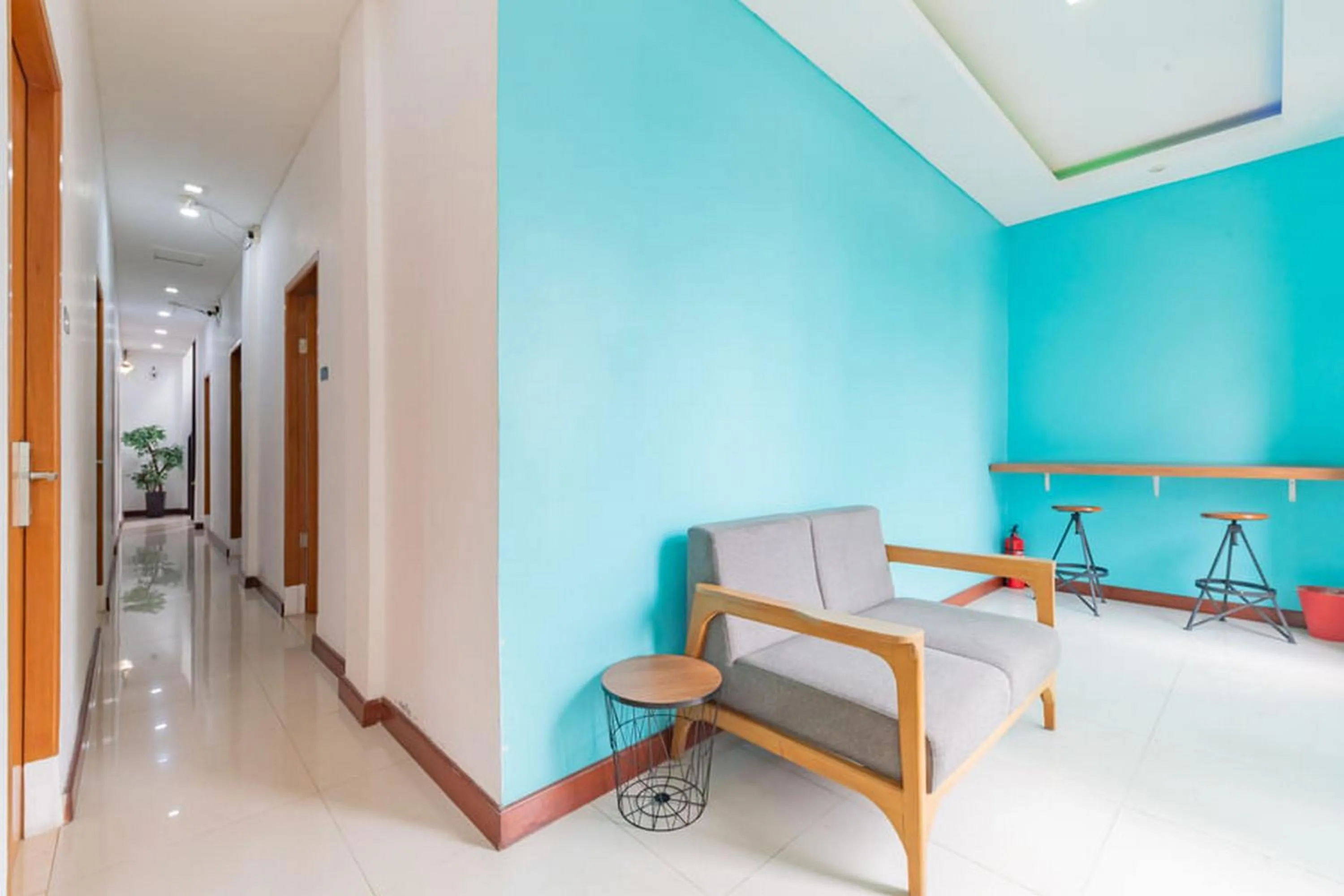 Seating area in Sans Hotel Suryakencana Bogor