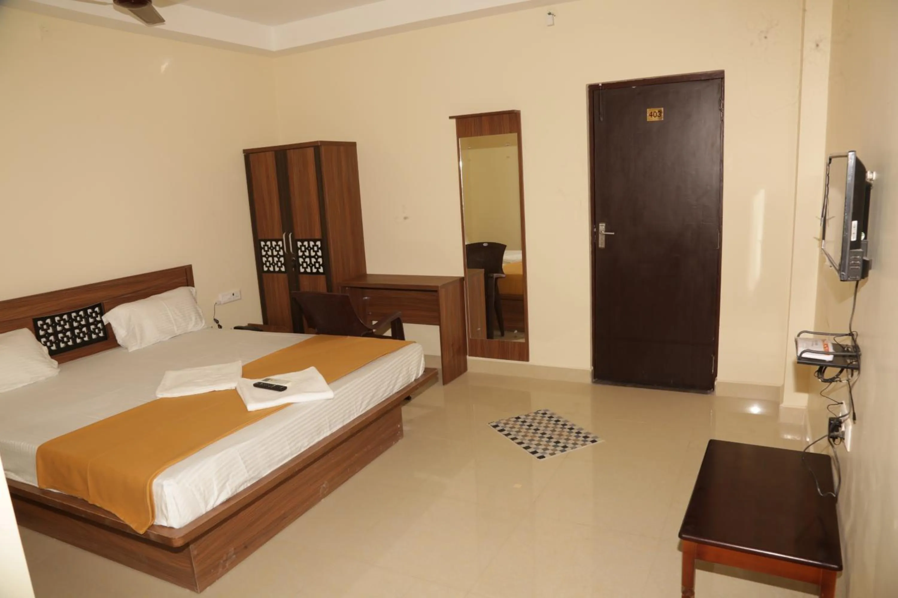Photo of the whole room, Bed in Santhosh Inn
