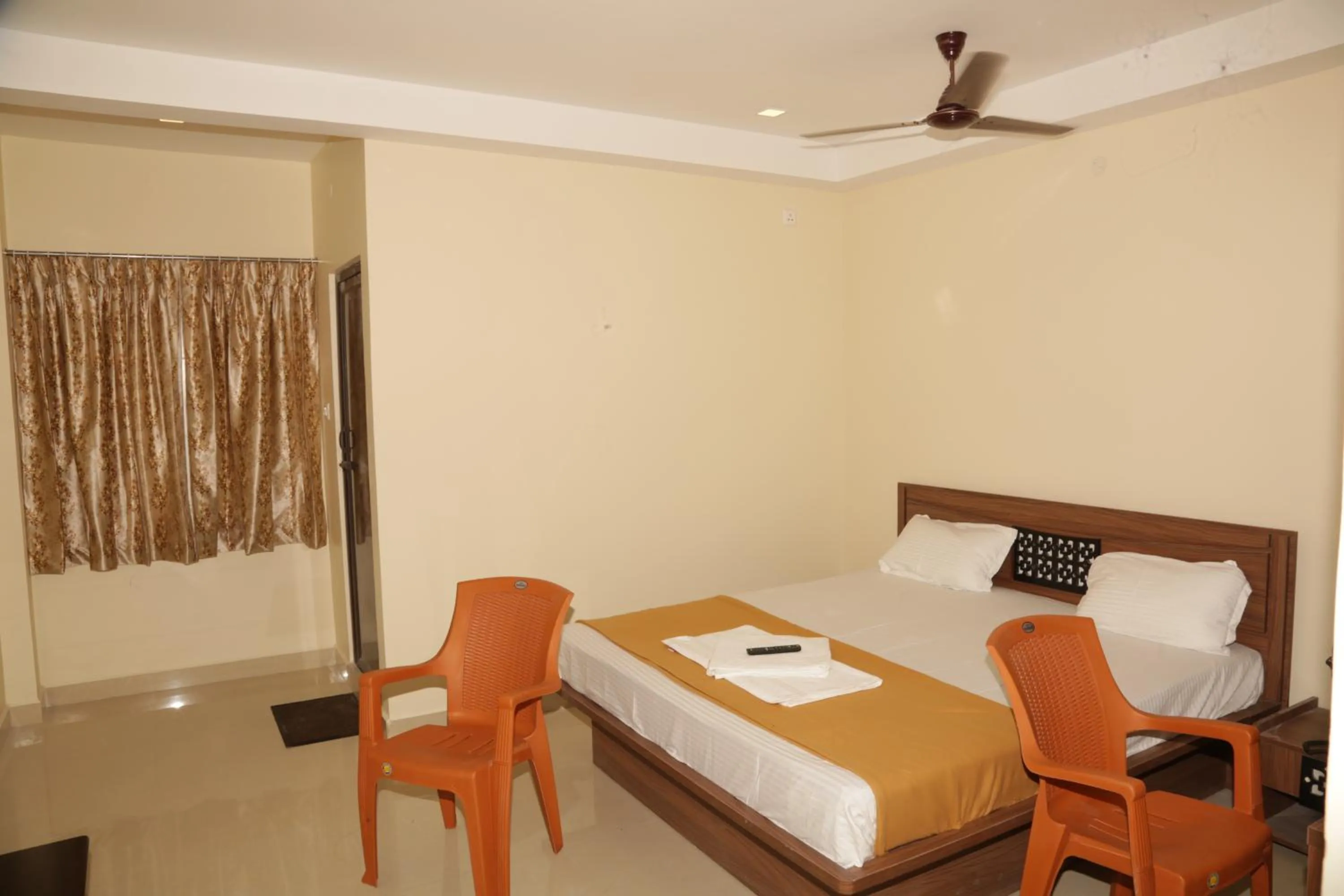 Photo of the whole room, Bed in Santhosh Inn