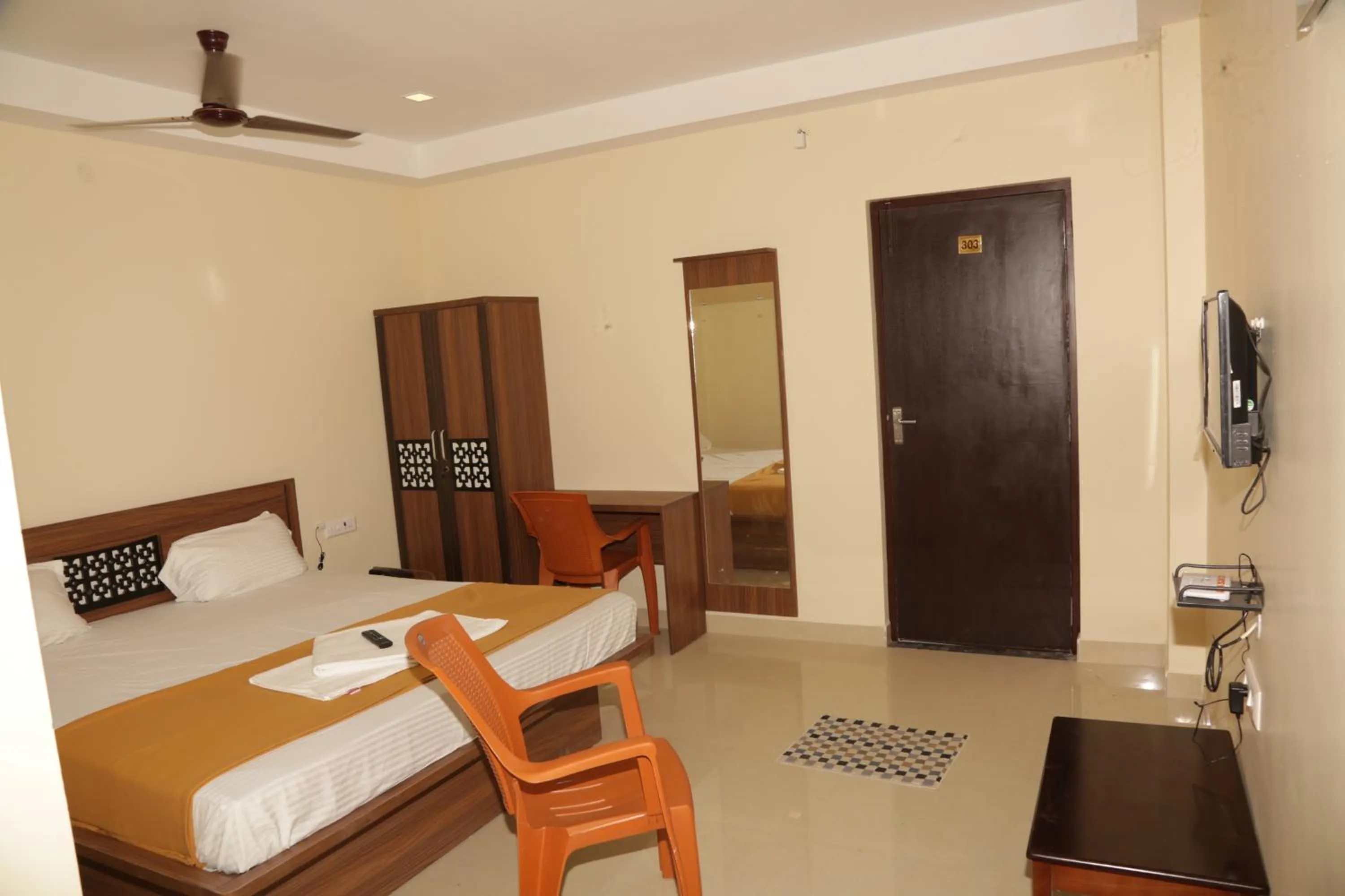 Photo of the whole room, Bed in Santhosh Inn