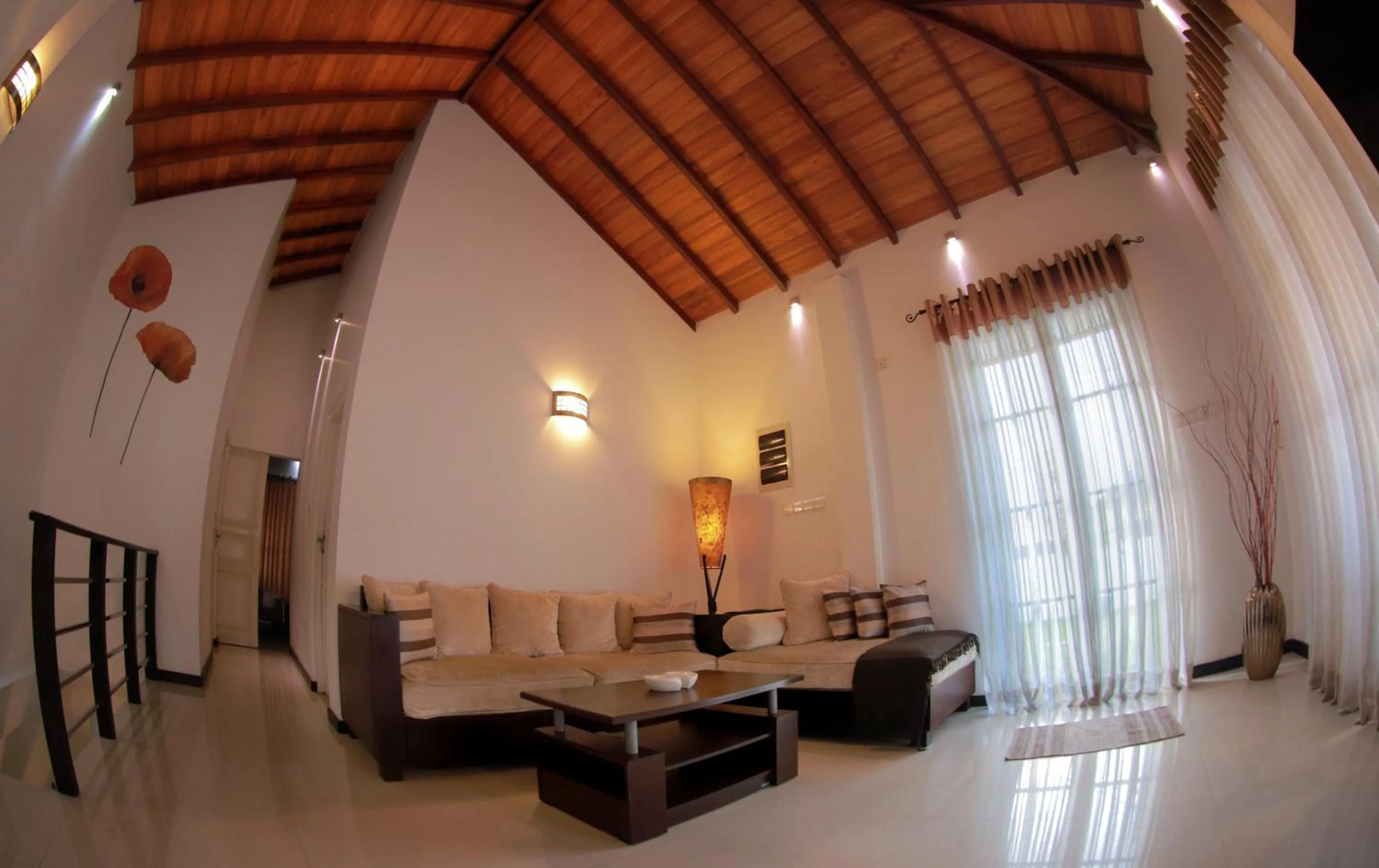 Communal lounge/ TV room in Blue Water Boutique Hotel