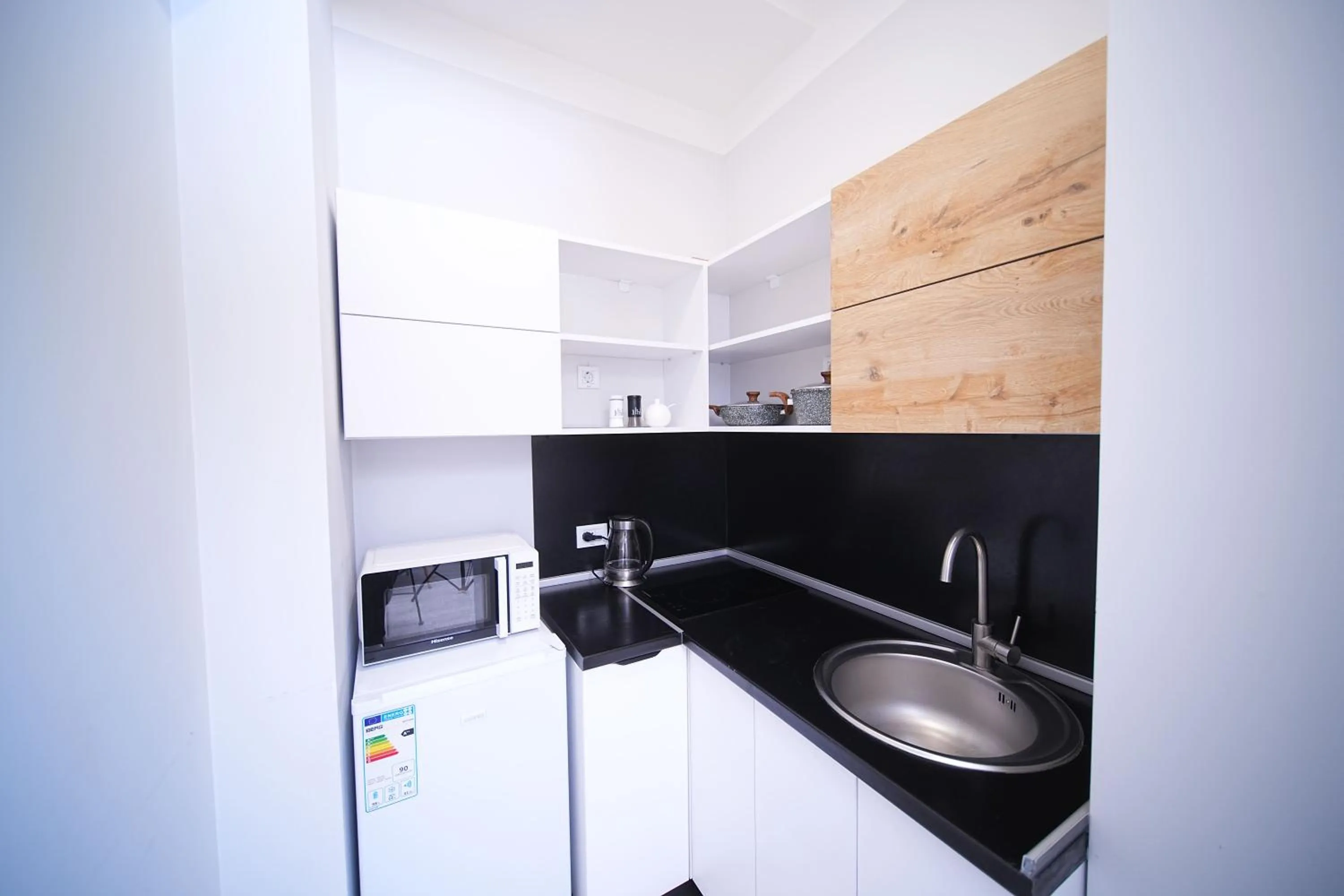 Kitchen or kitchenette in Sweet Home Apart-Hotel