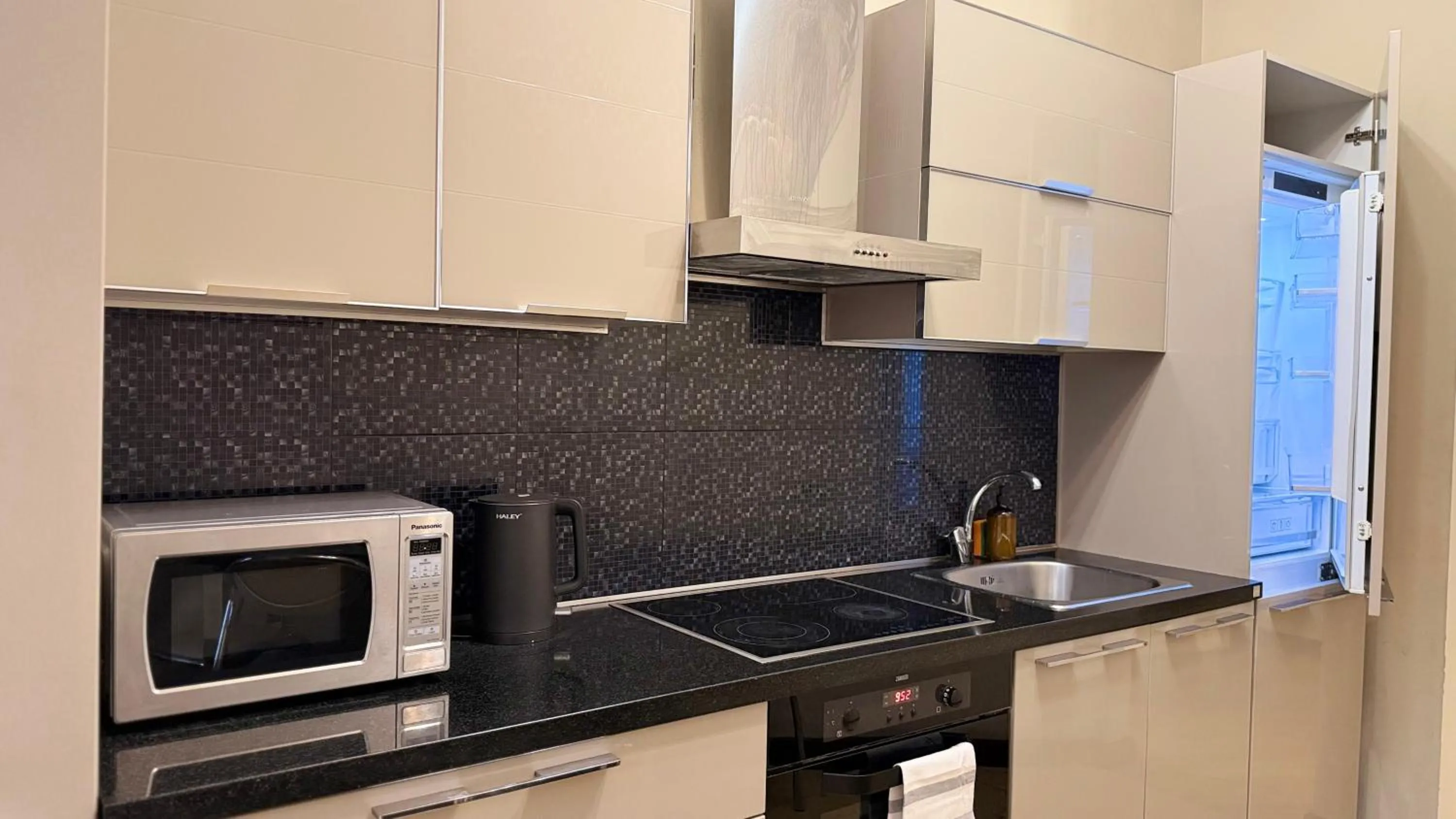 Kitchen or kitchenette in Sweet Home Apart-Hotel
