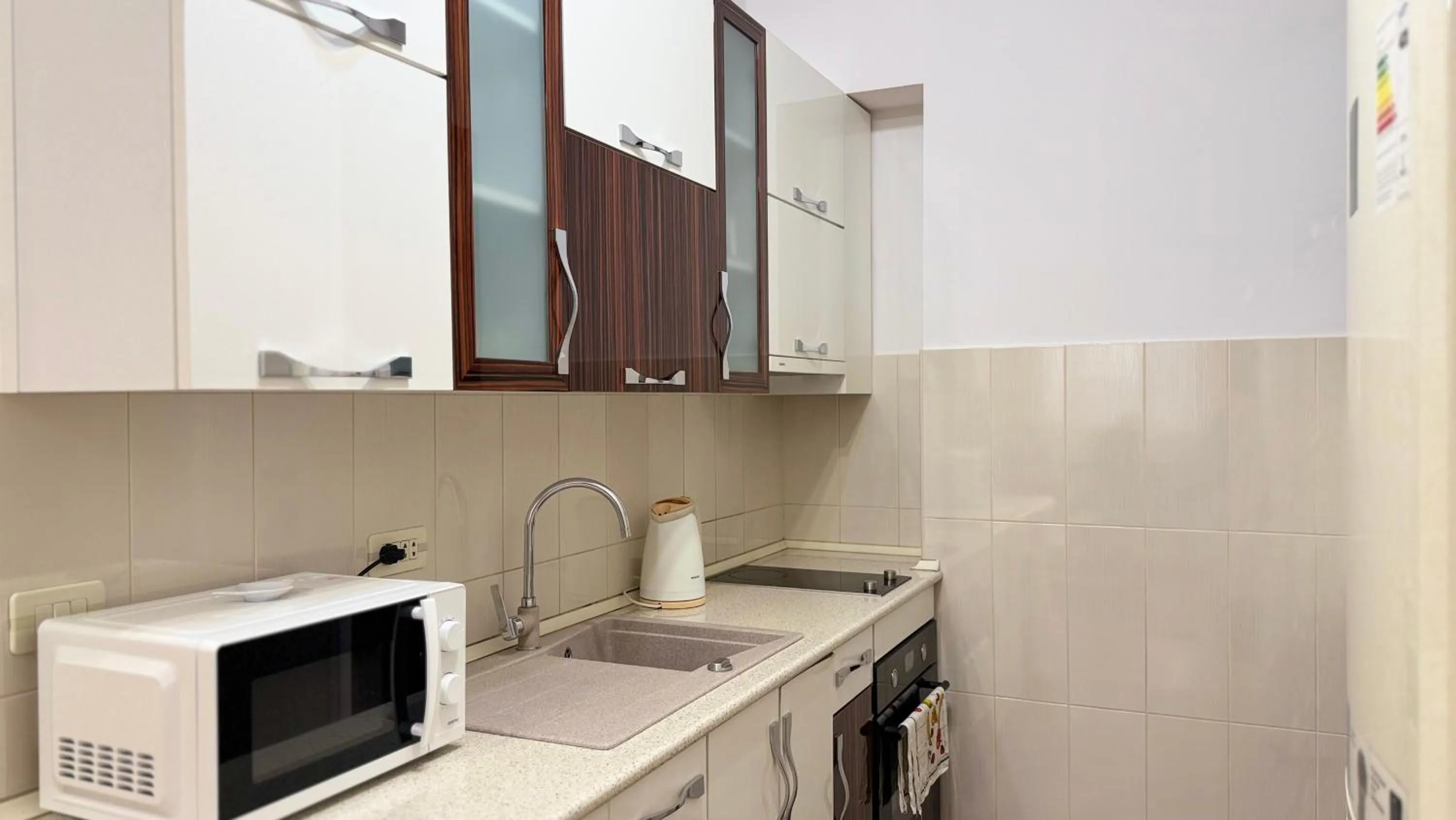 Kitchen or kitchenette in Sweet Home Apart-Hotel