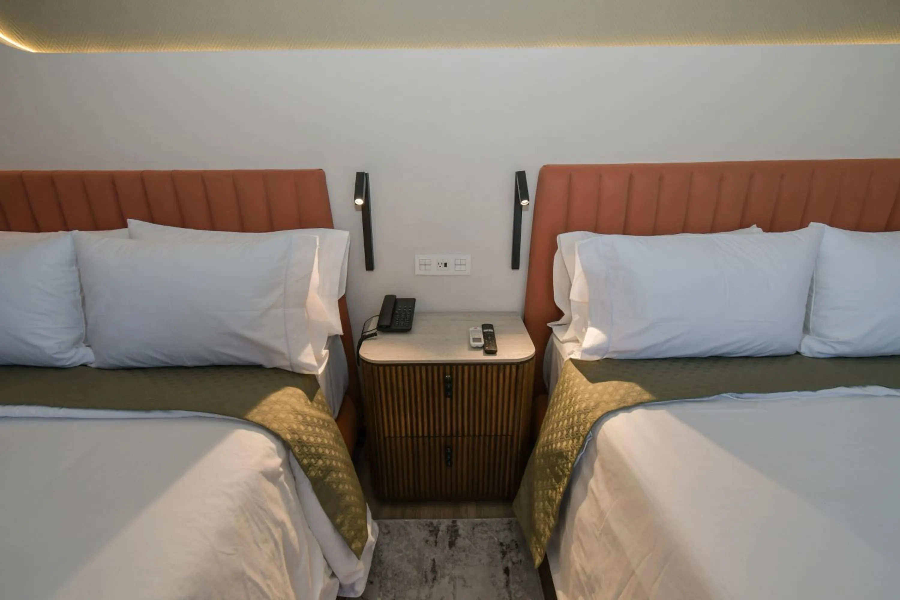 Bed in Expo Satelite 2750 Hotel & Suites