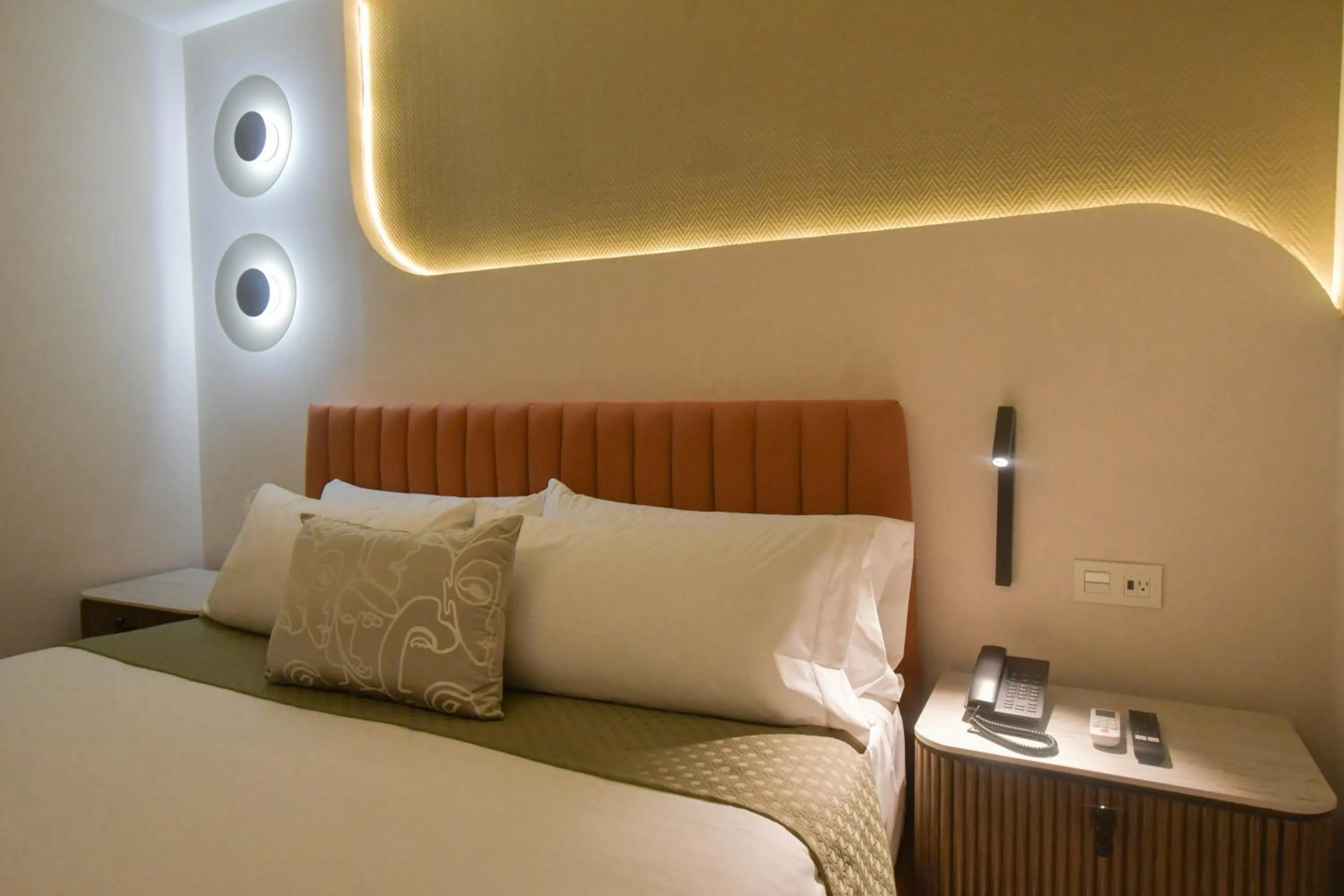 Bed in Expo Satelite 2750 Hotel & Suites