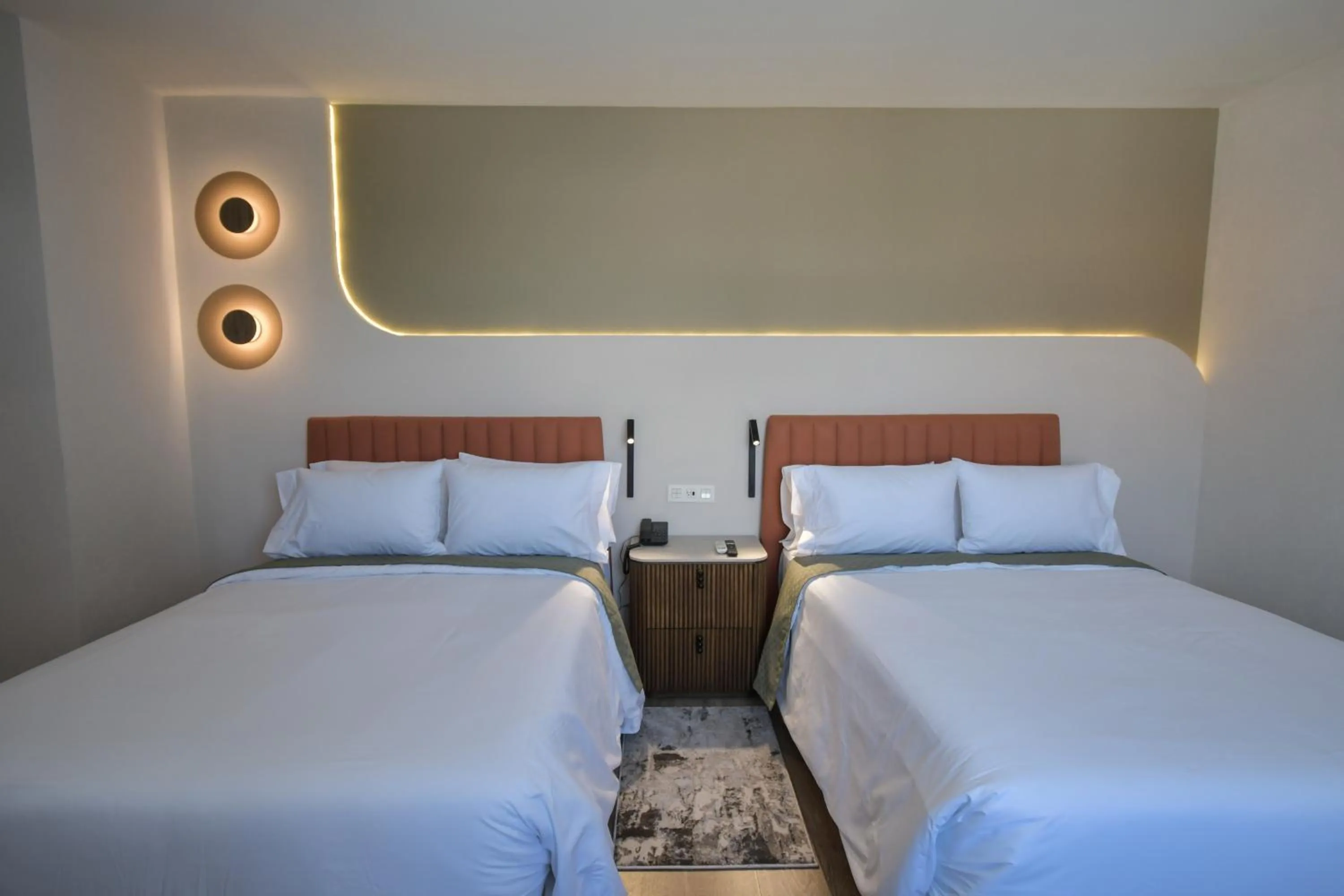 Bed in Expo Satelite 2750 Hotel & Suites