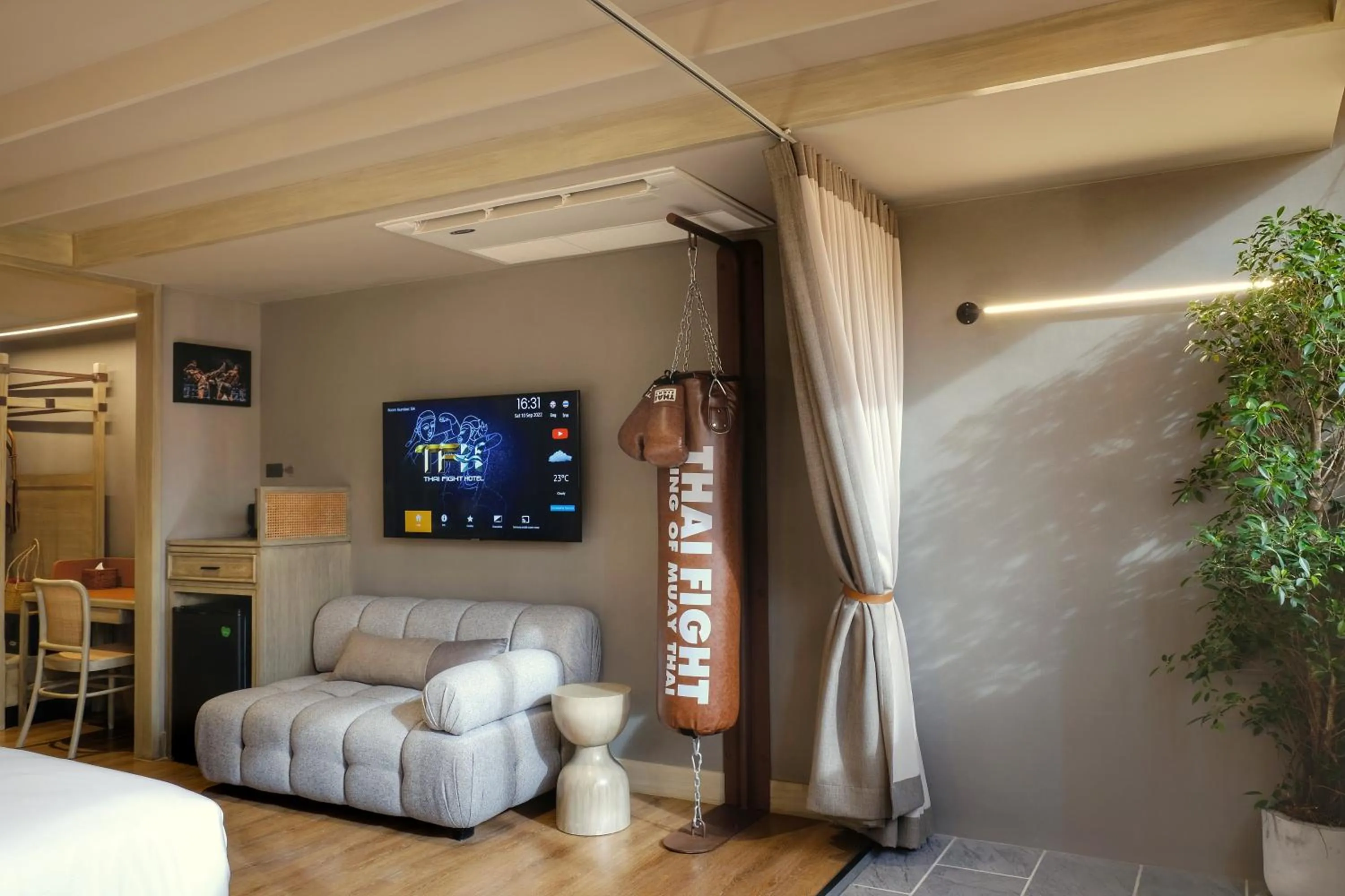 Seating area, Bed in Thai Fight Hotel