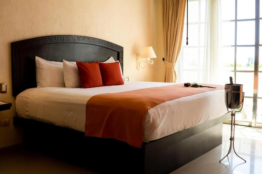 Bed in Posada Sian Kaan Playa del Carmen - Wellness Oriented Hotel