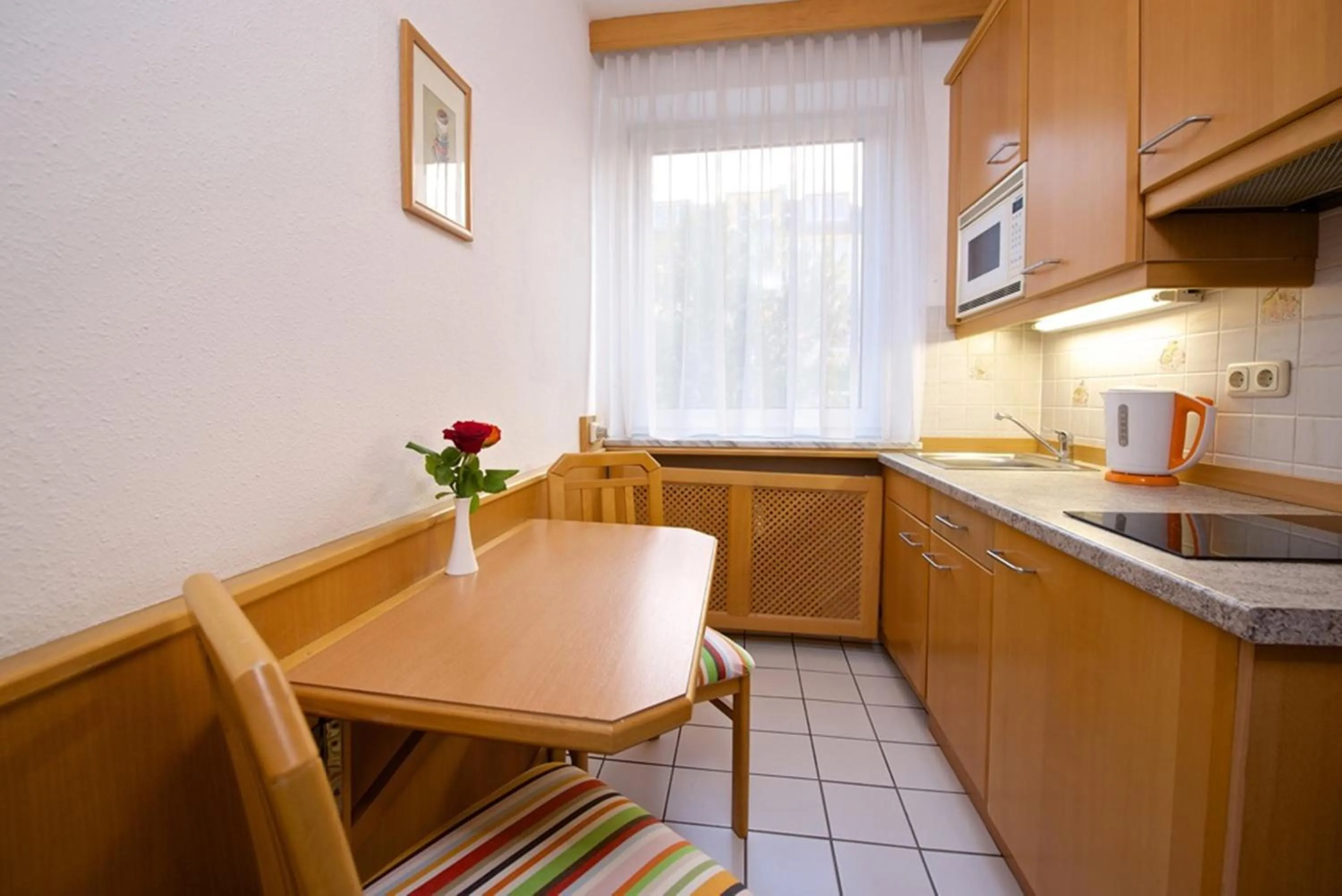 Kitchen or kitchenette in Park Hotel Laim Serviced Apartments