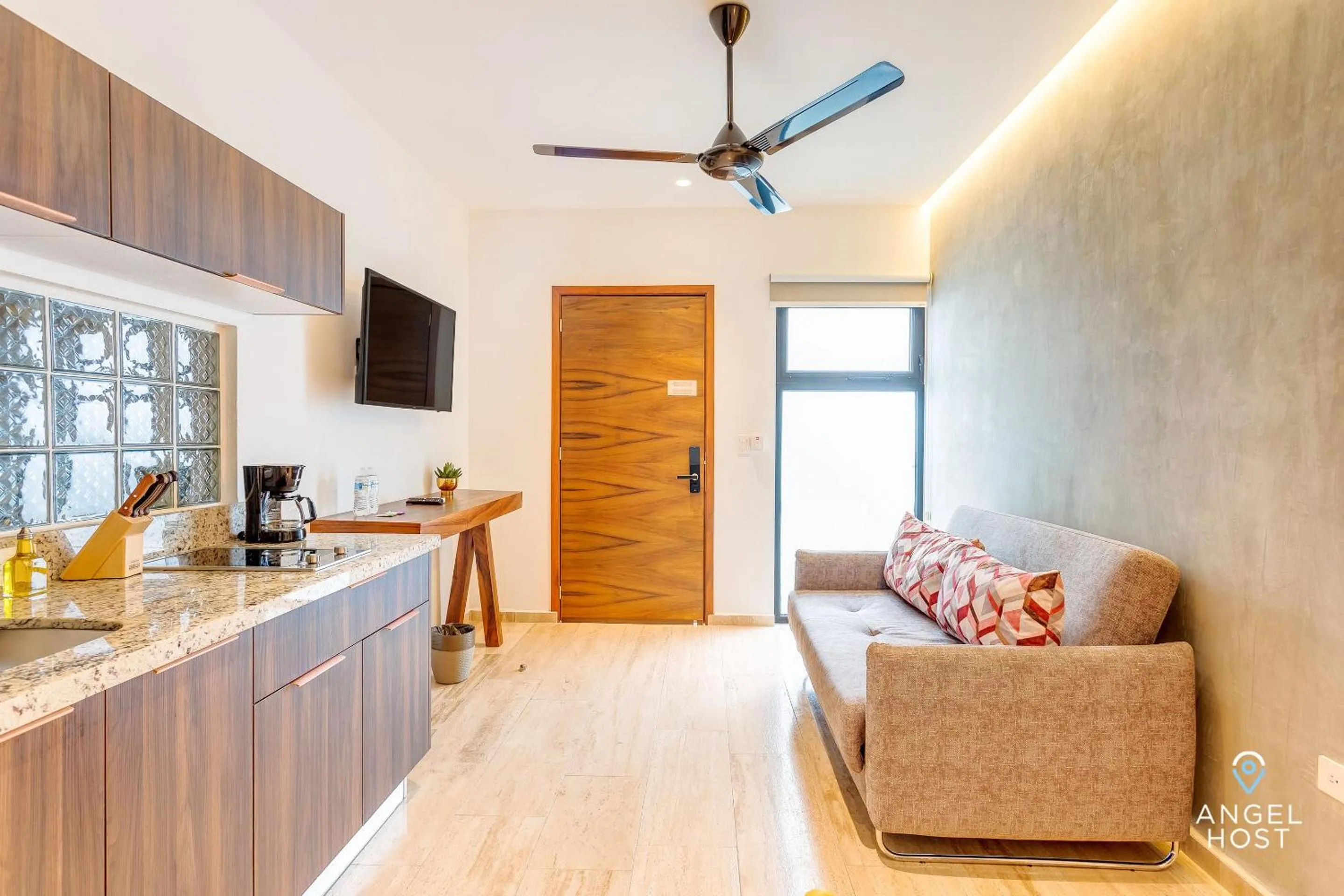 Living room in Chic Condotel with Roof Pool 10-Min Walk to Beach