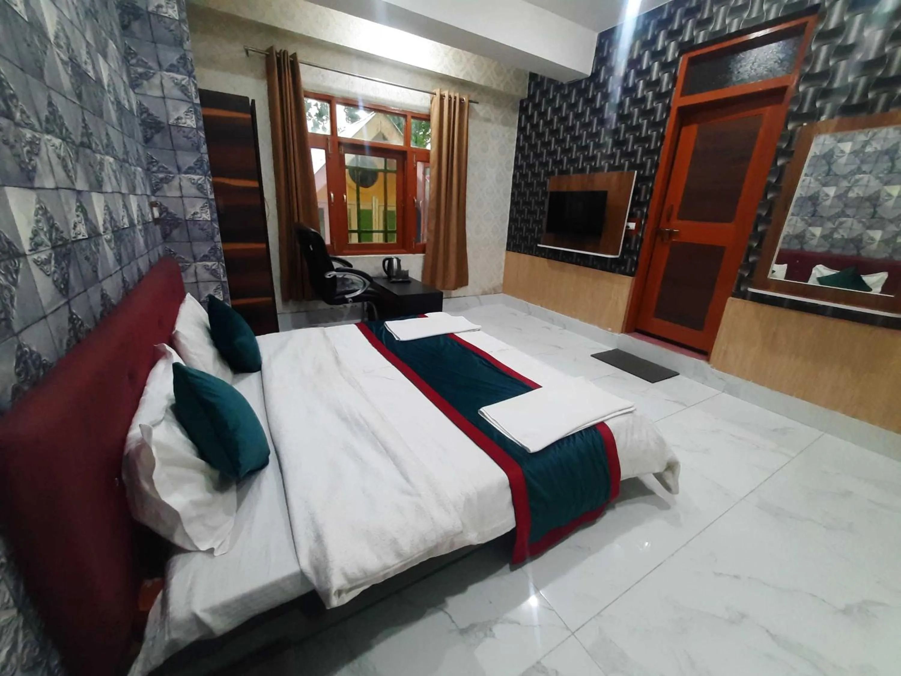 Bedroom in Hotel O by OYO Graceland