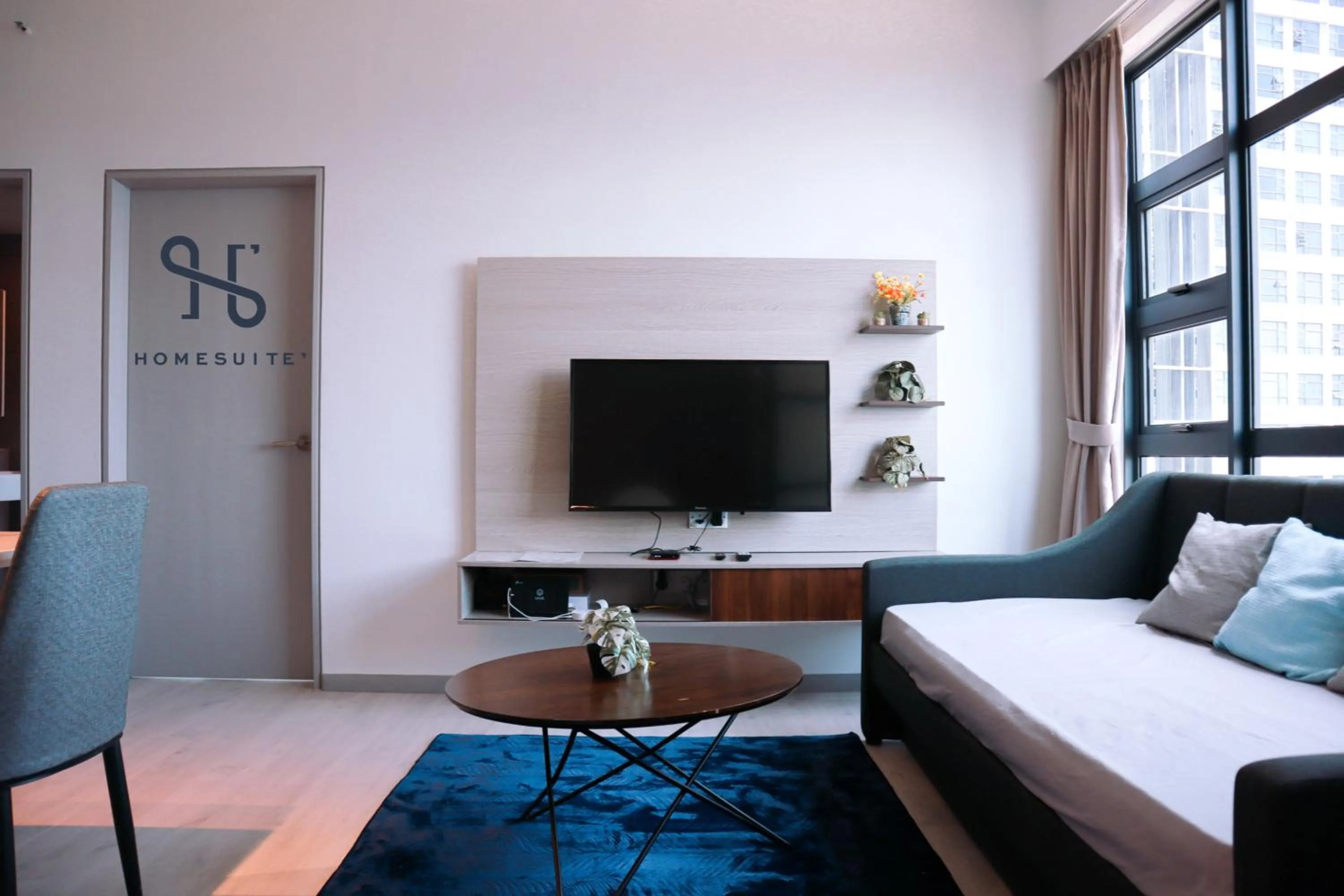 Living room, Bed in Homesuite' Home at Jesselton Quay