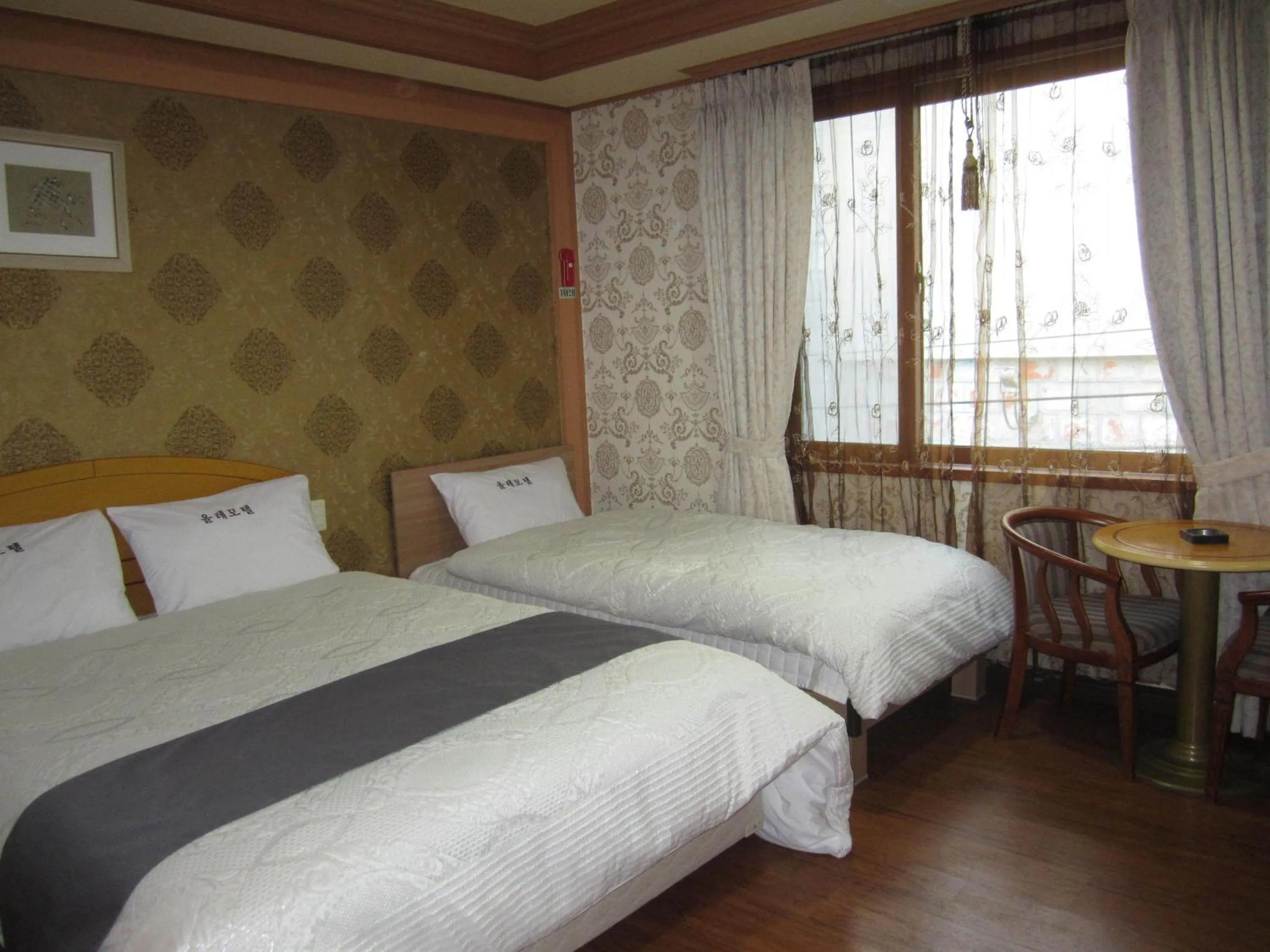 Bed in Jeju Olleh Hotel