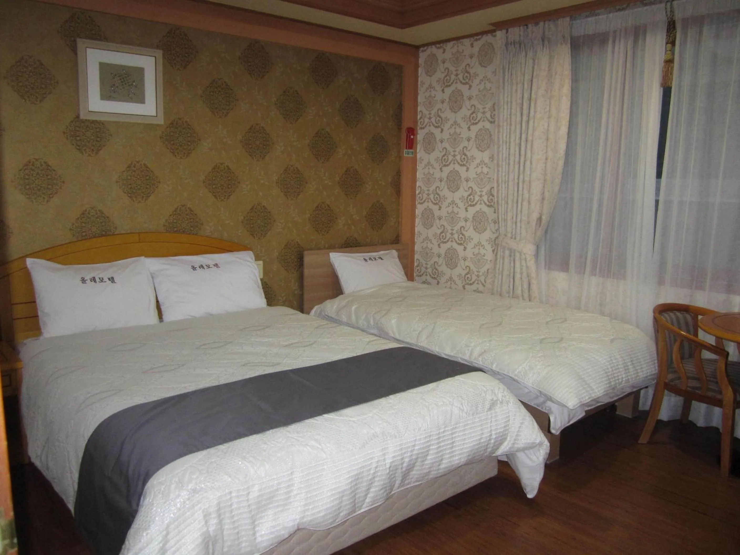 Bed in Jeju Olleh Hotel