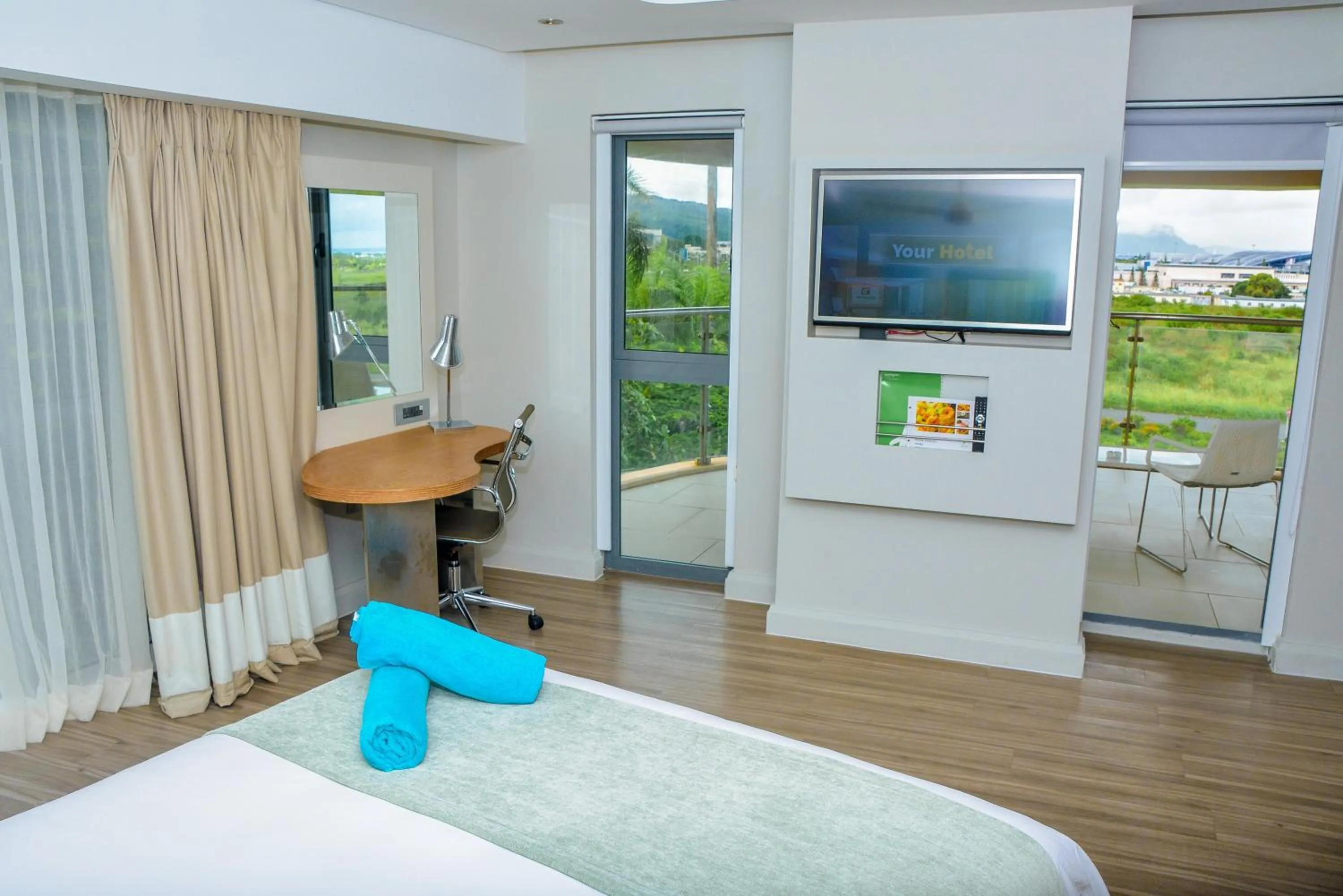 Photo of the whole room, Bed in Holiday Inn Mauritius Mon Trésor by IHG