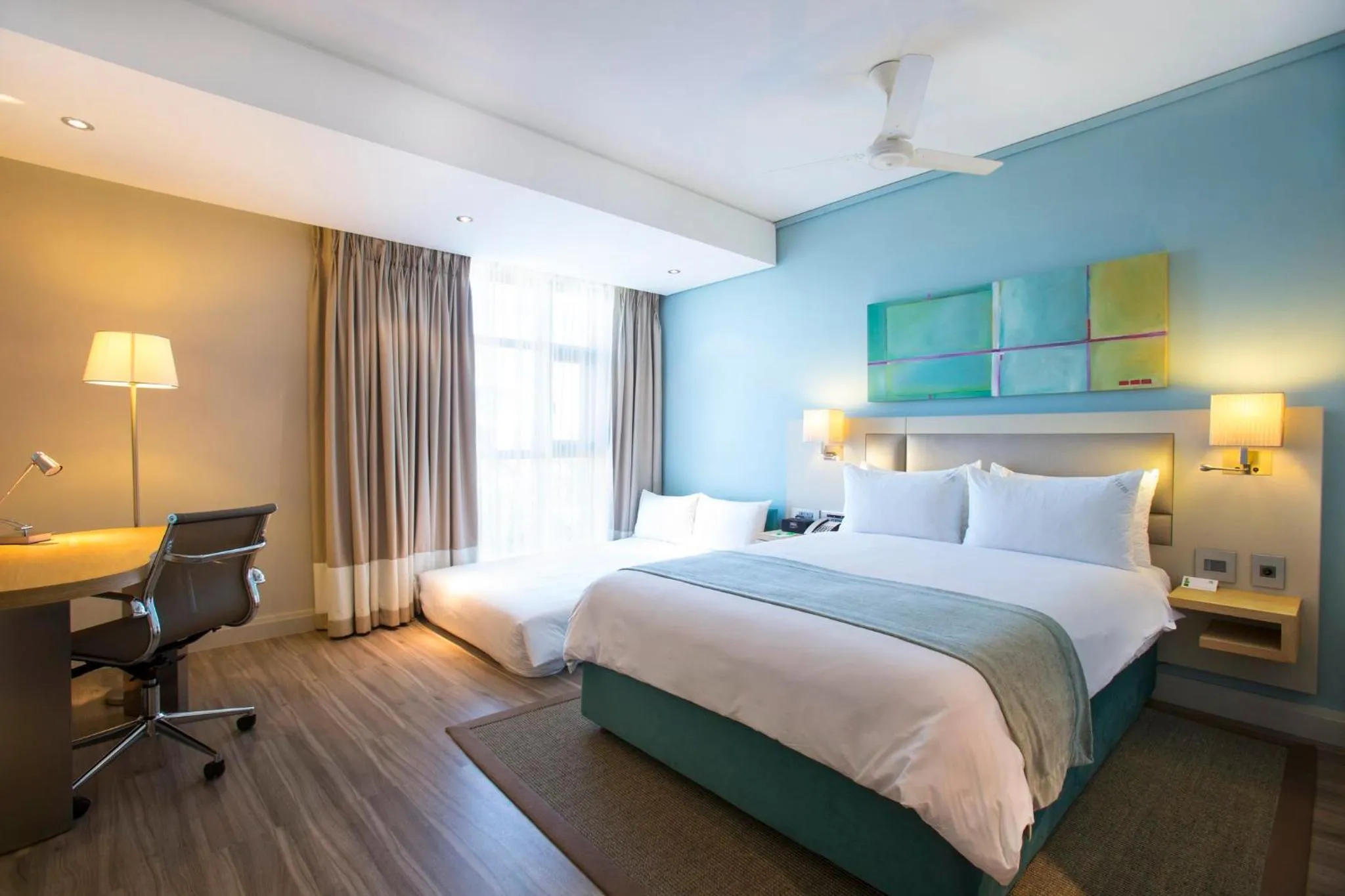 Photo of the whole room, Bed in Holiday Inn Mauritius Mon Trésor by IHG