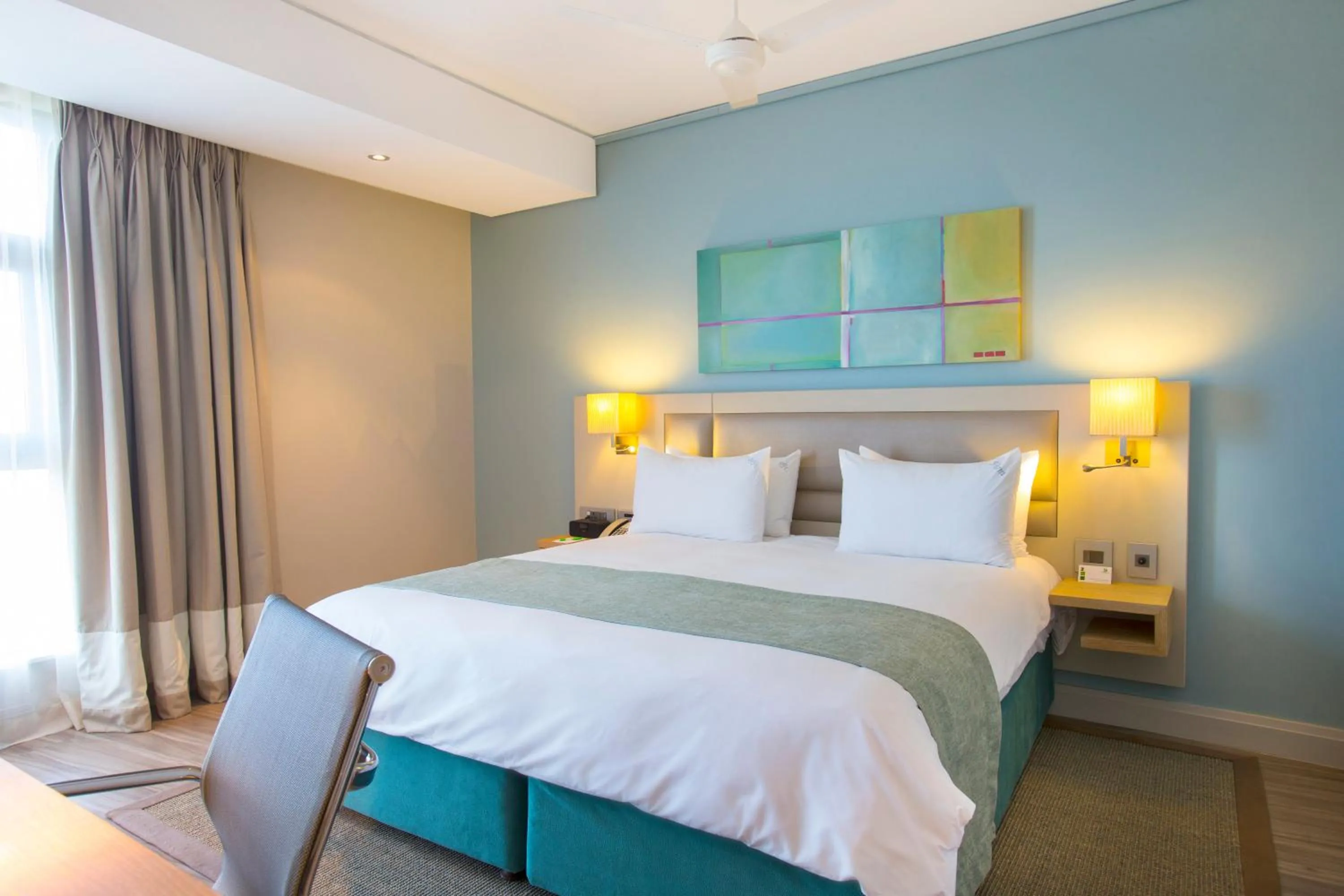 Photo of the whole room, Bed in Holiday Inn Mauritius Mon Trésor by IHG