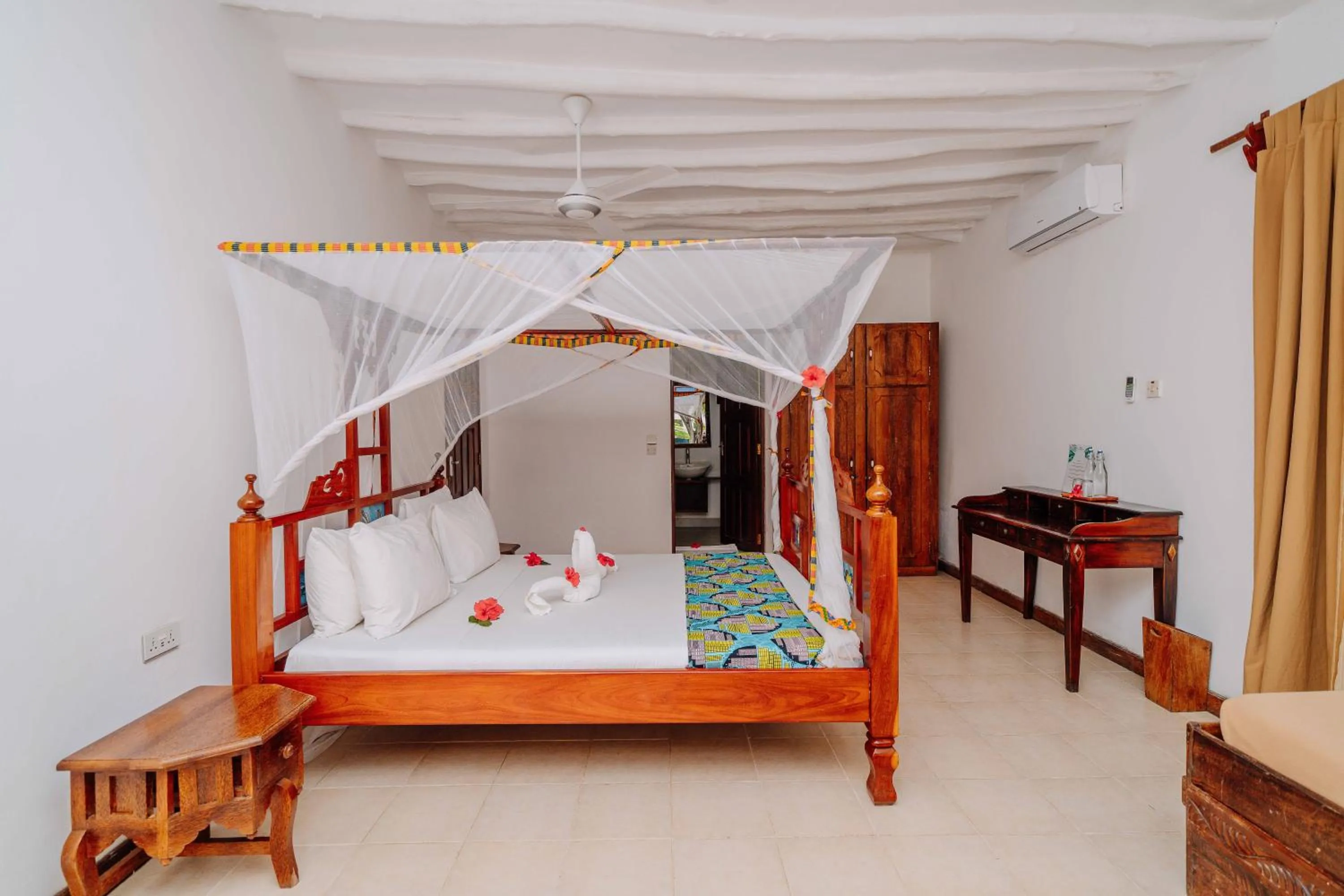 Bed in Spice Island Hotel & Resort
