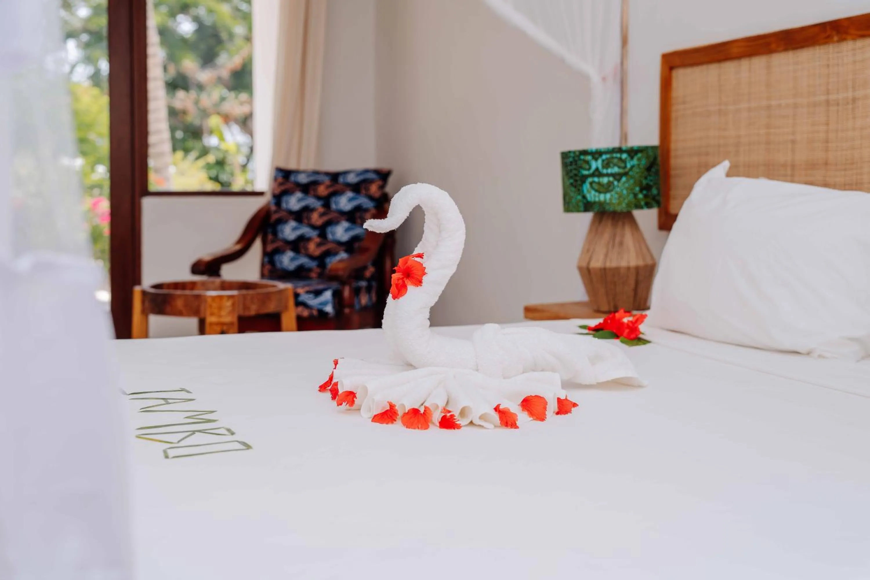 Bed in Spice Island Hotel & Resort