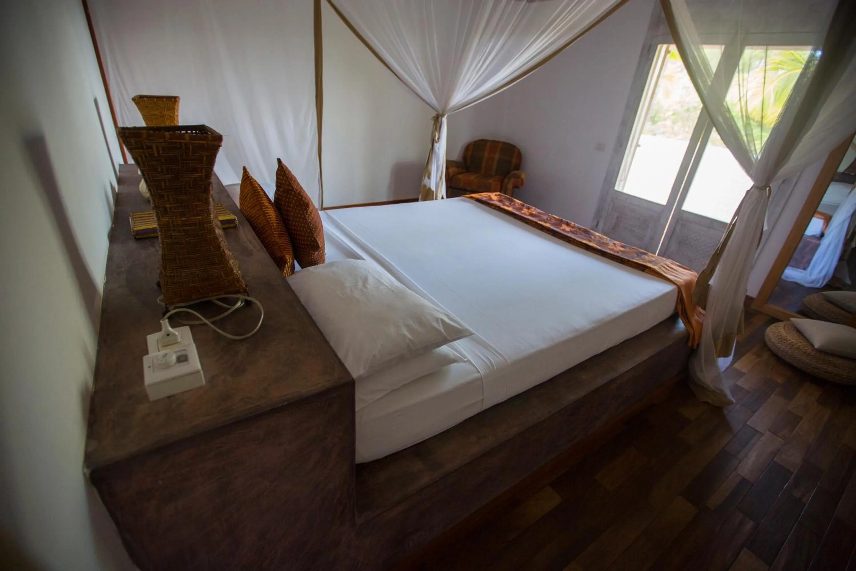 Bed in Uzuri Boutique Hotel