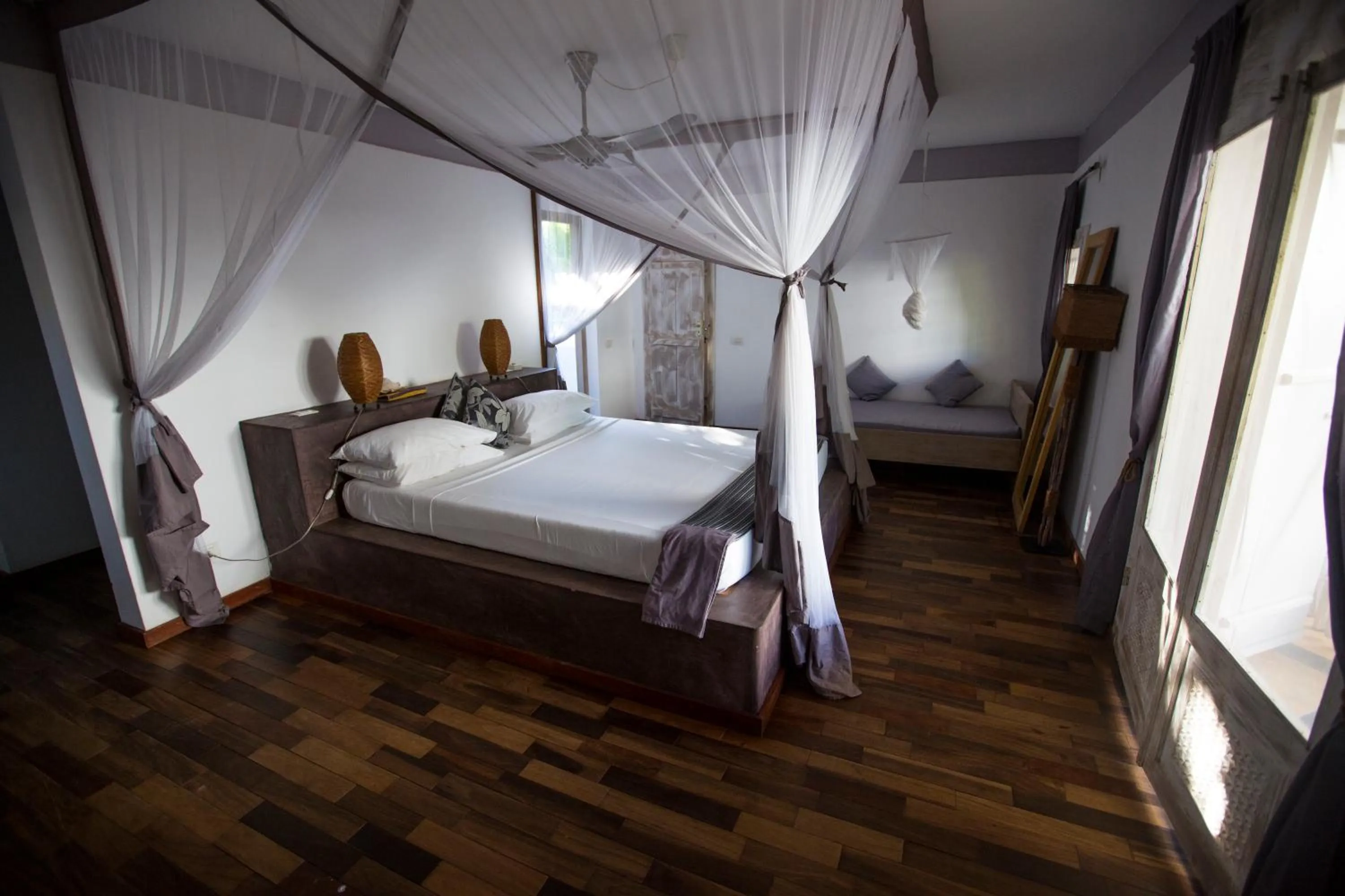 Bed in Uzuri Boutique Hotel