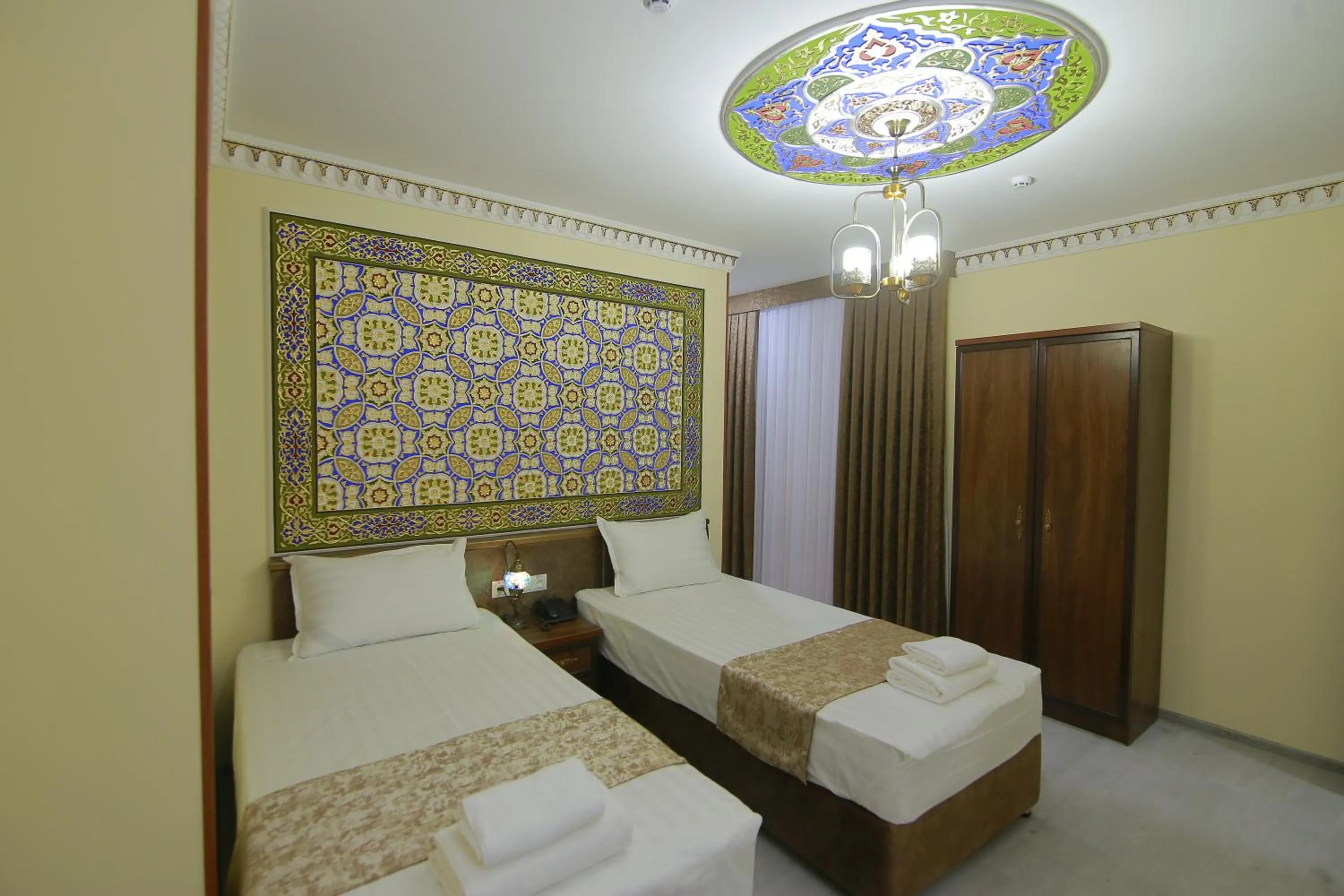 Bed in Sahar Boutique Hotel