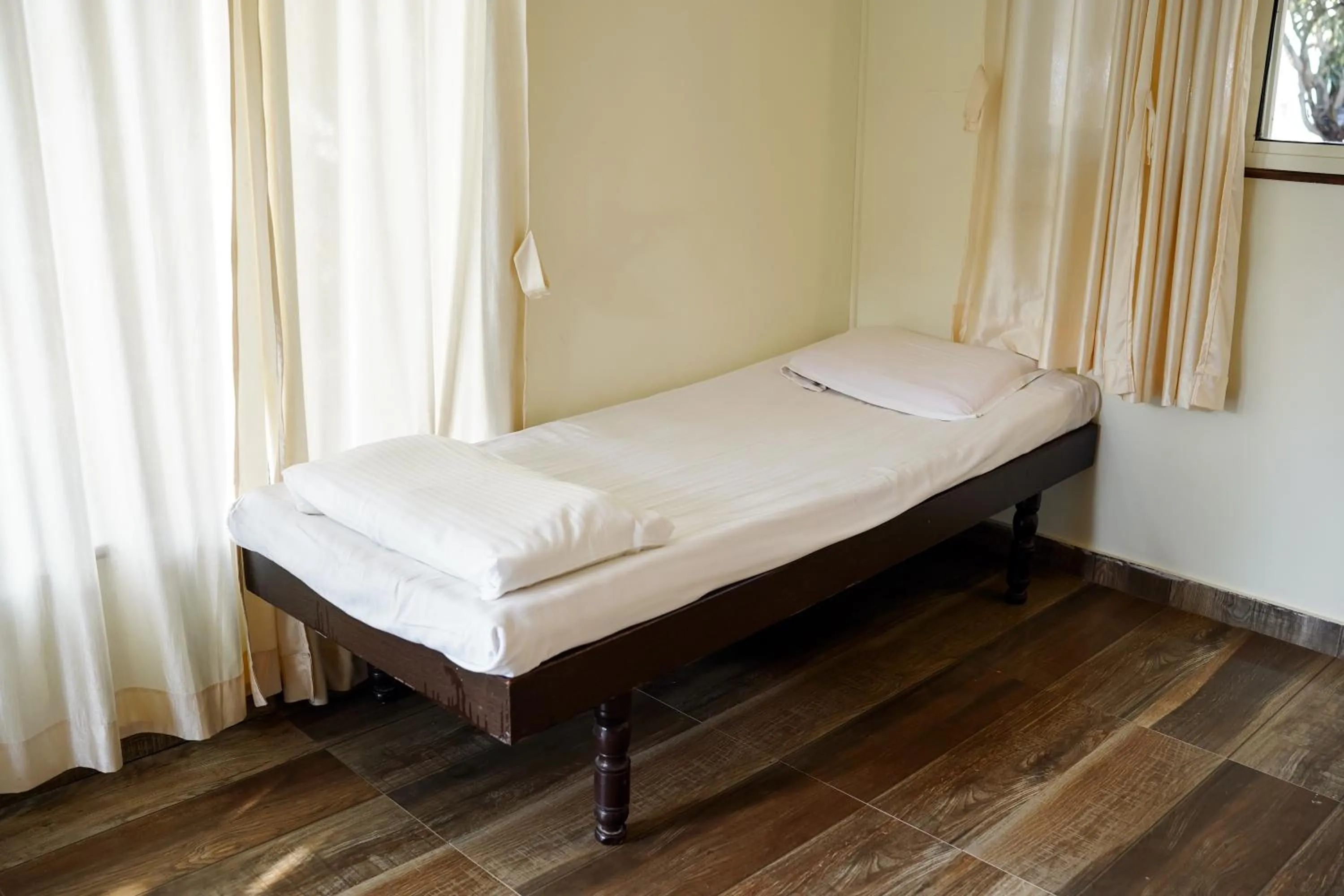 Bed in VIRASAT RESORT