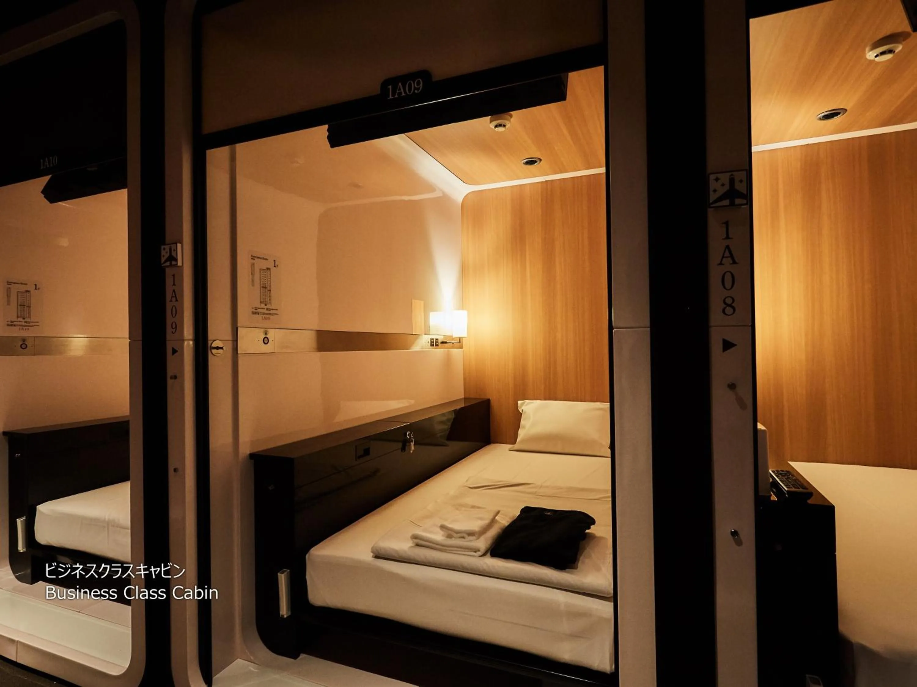 Photo of the whole room, Bed in First Cabin Nishi Umeda