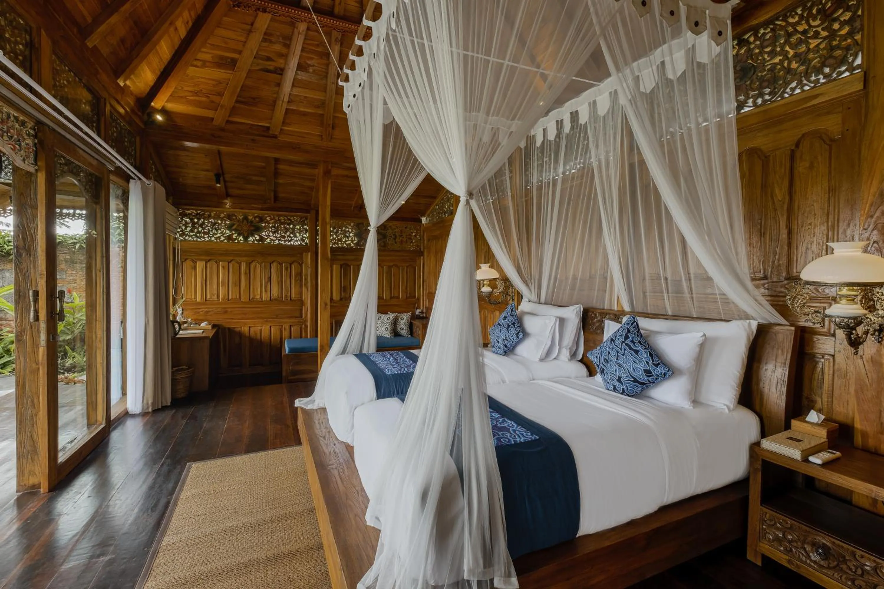 Bed in Airsania Ubud Antique Villas