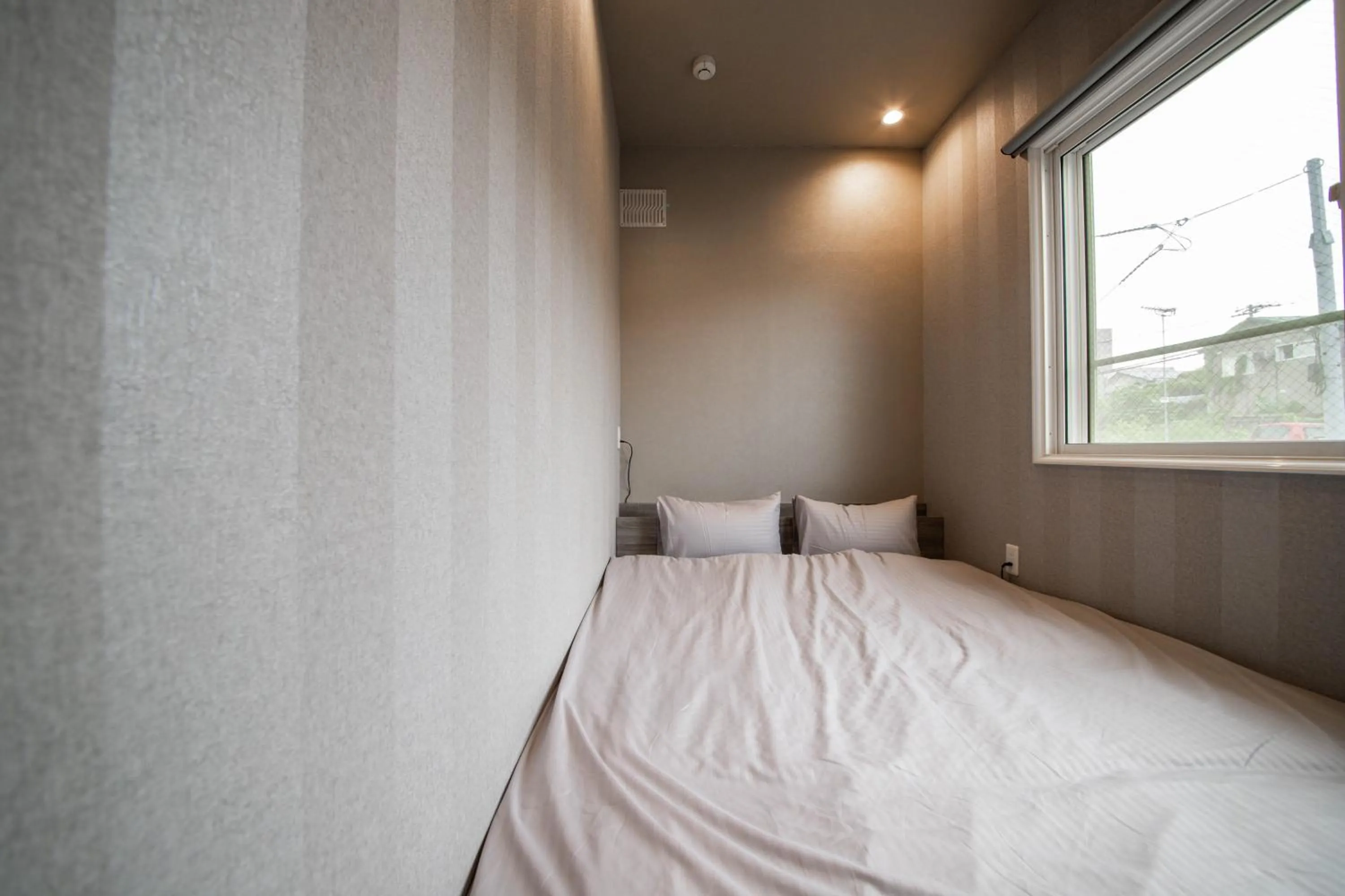 Bed in THE BEEHIVE AIOI