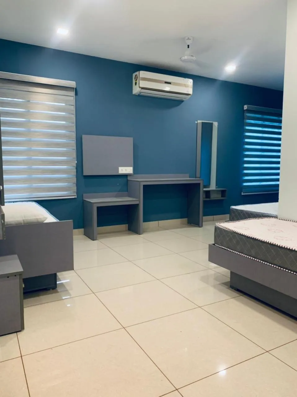 Living room, Bed in Emerald Royal Residency