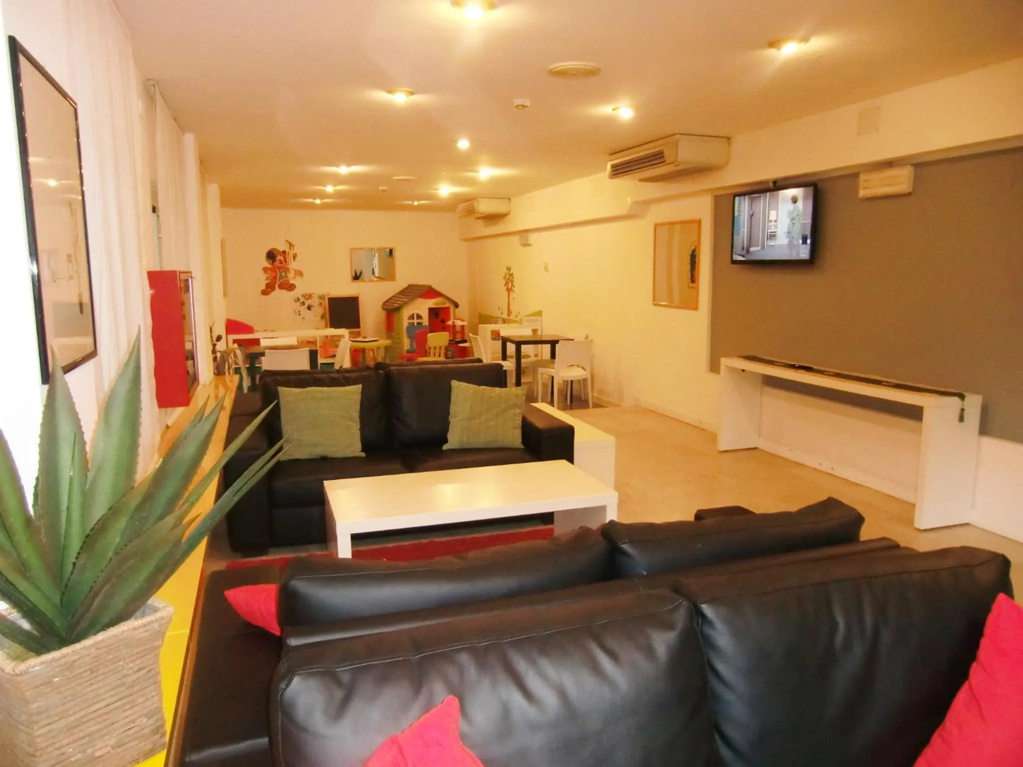Communal lounge/ TV room in Hotel Desire'