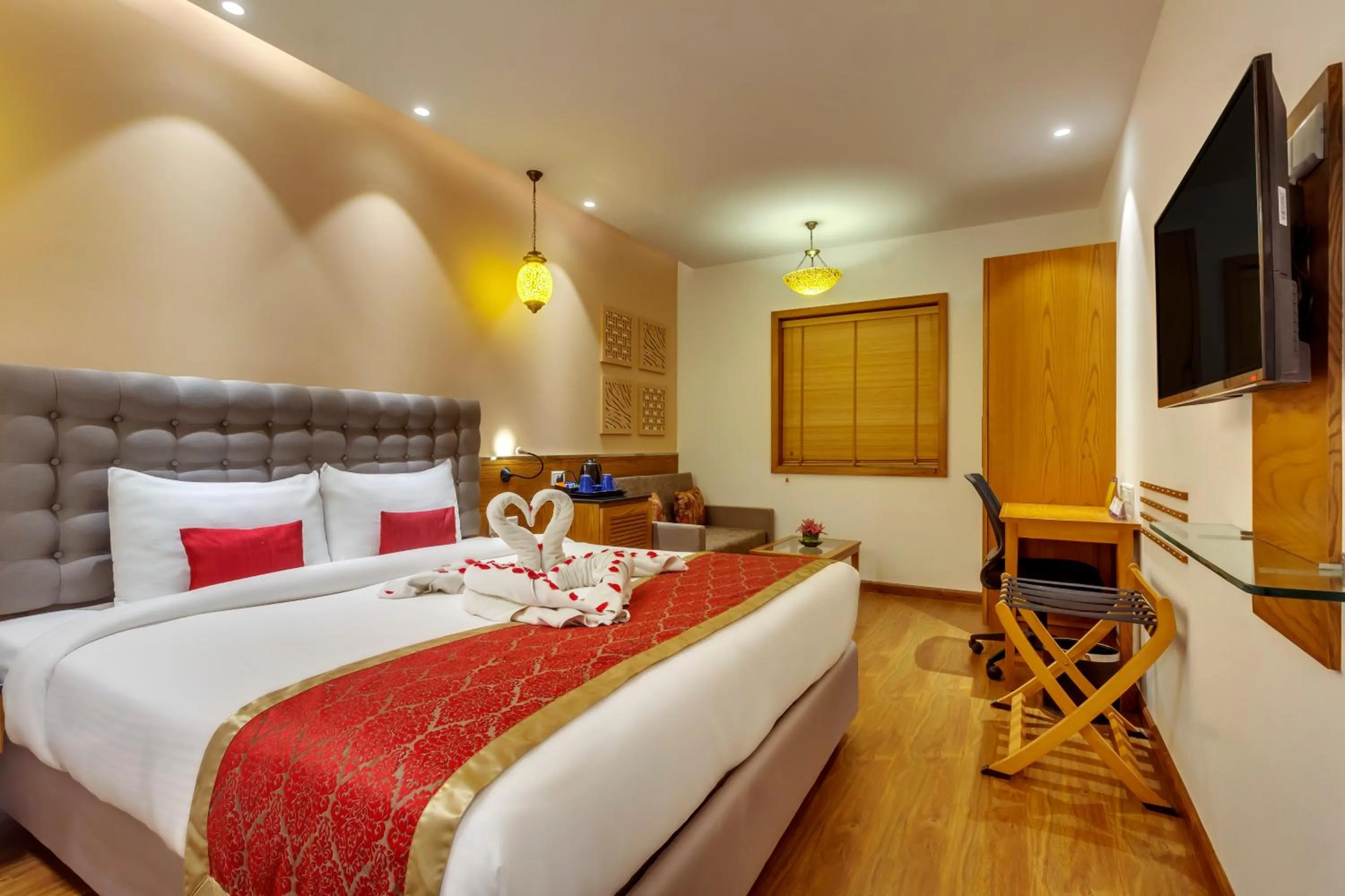 Photo of the whole room, Bed in Golden Tulip New Delhi - Hari Nagar