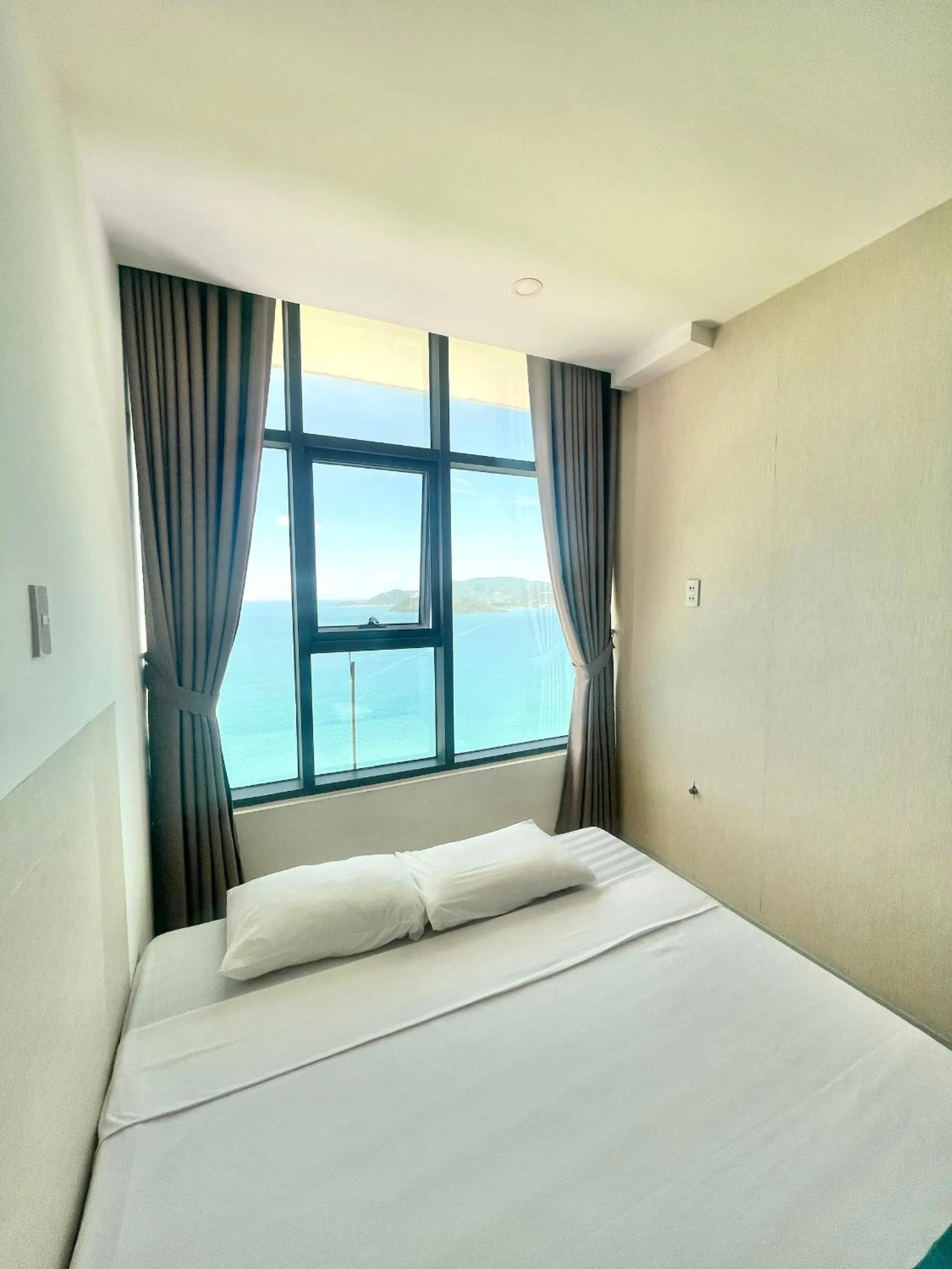 Bed in Pearl Nha Trang Beach Apartment