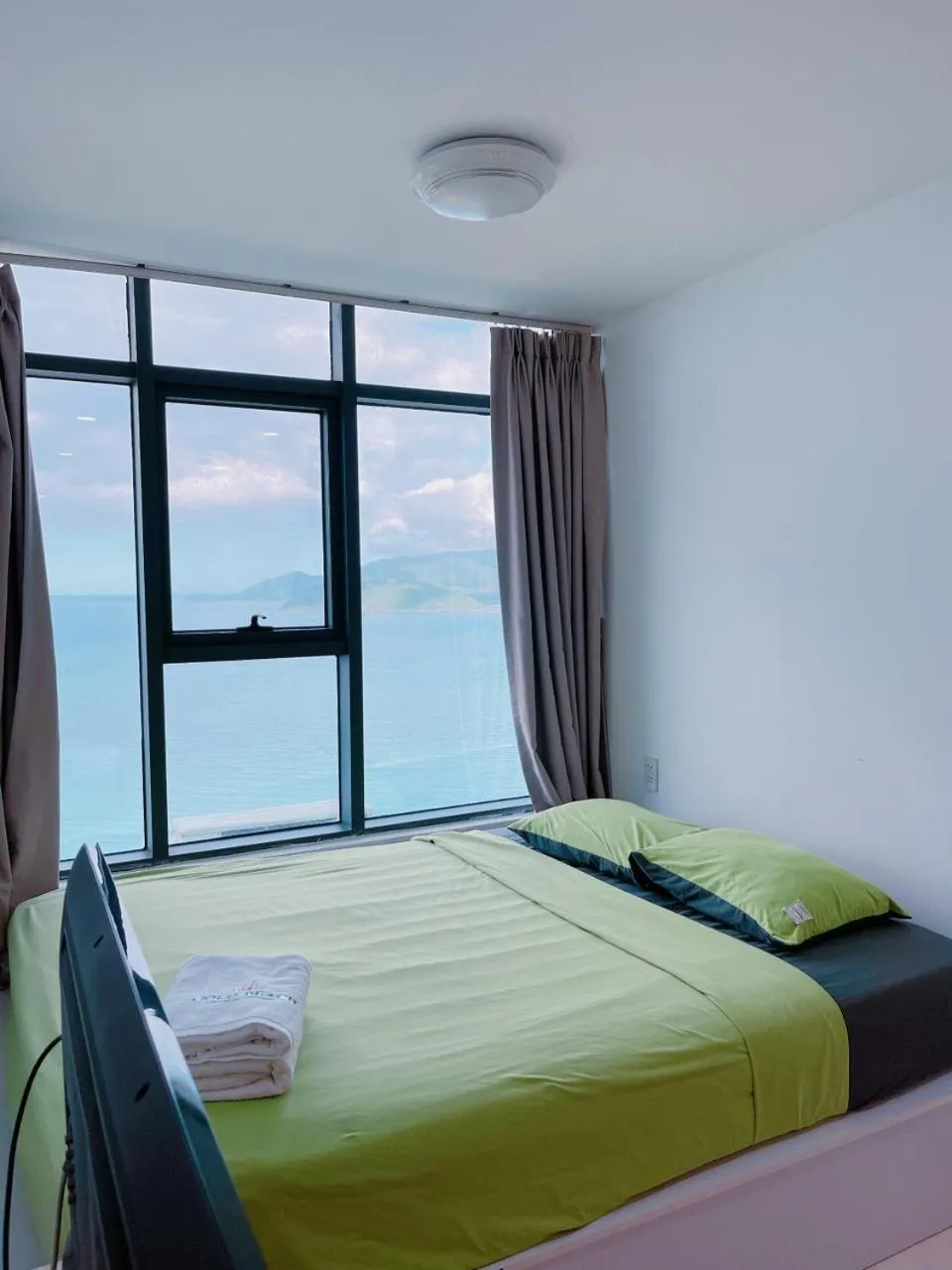 Bed in Pearl Nha Trang Beach Apartment