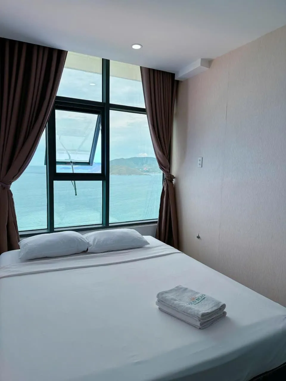 Bed in Pearl Nha Trang Beach Apartment