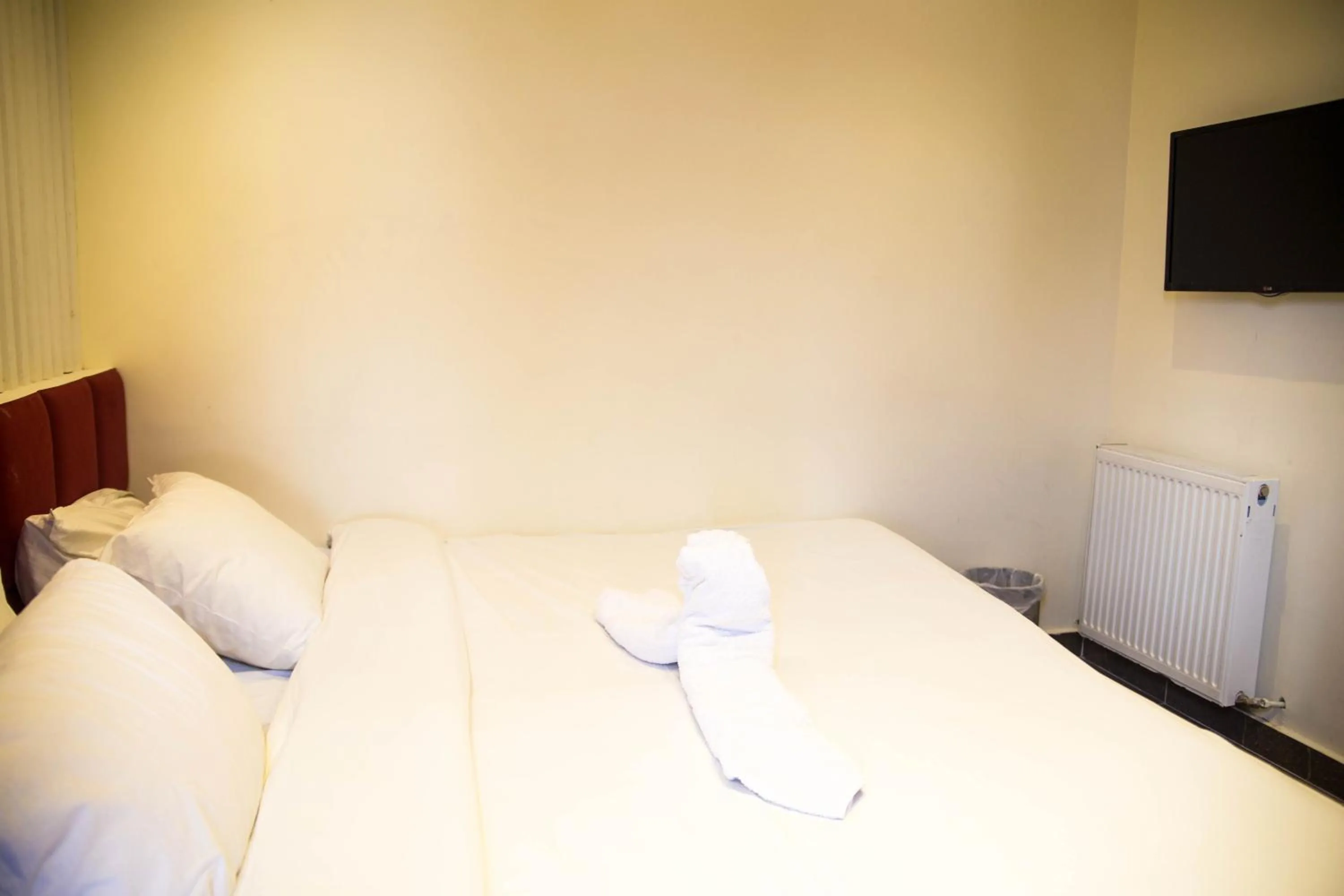 Bed in Metropole Hotel