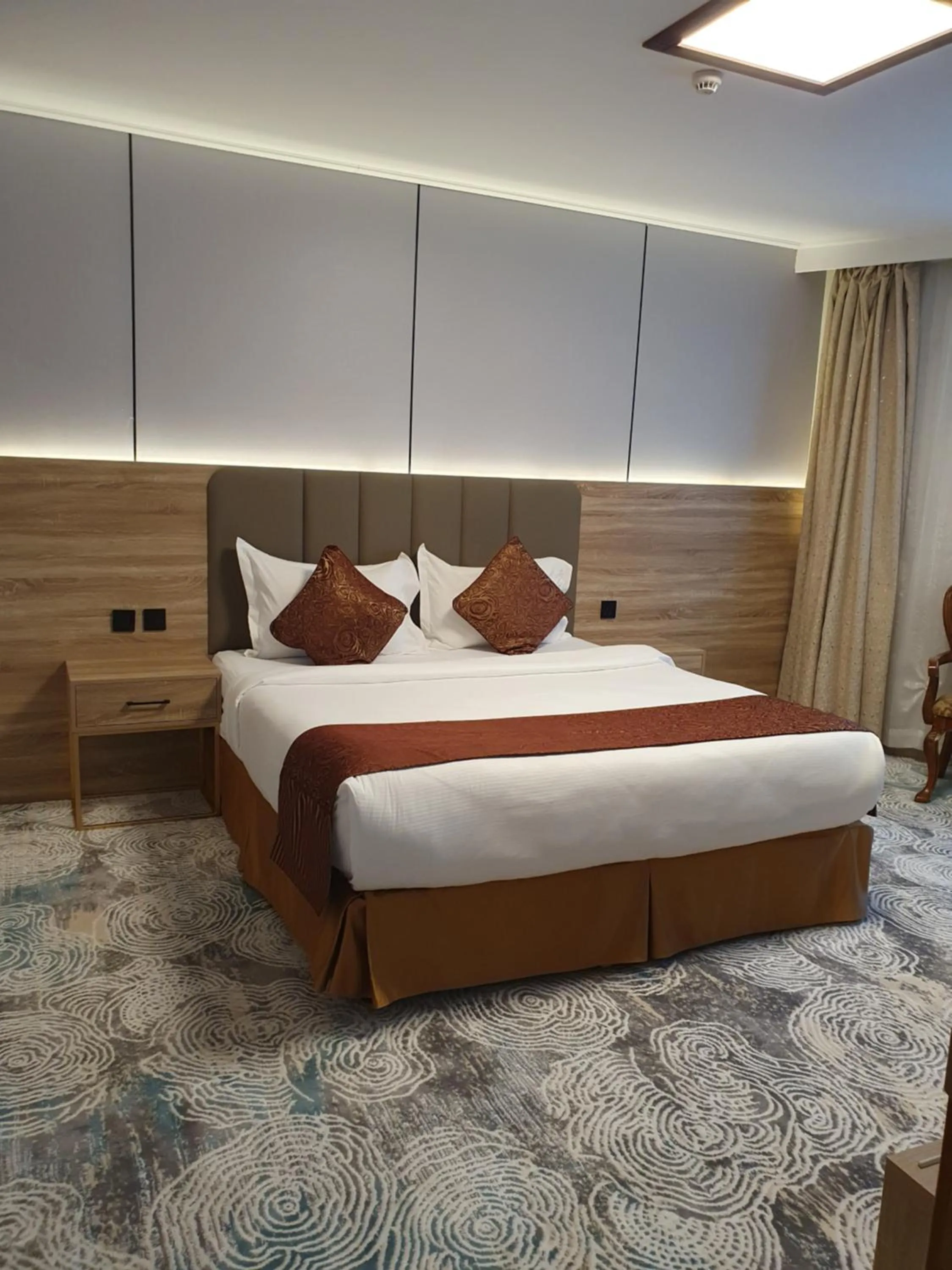 Bed in Sadeem Al Fajr Hotel Suites