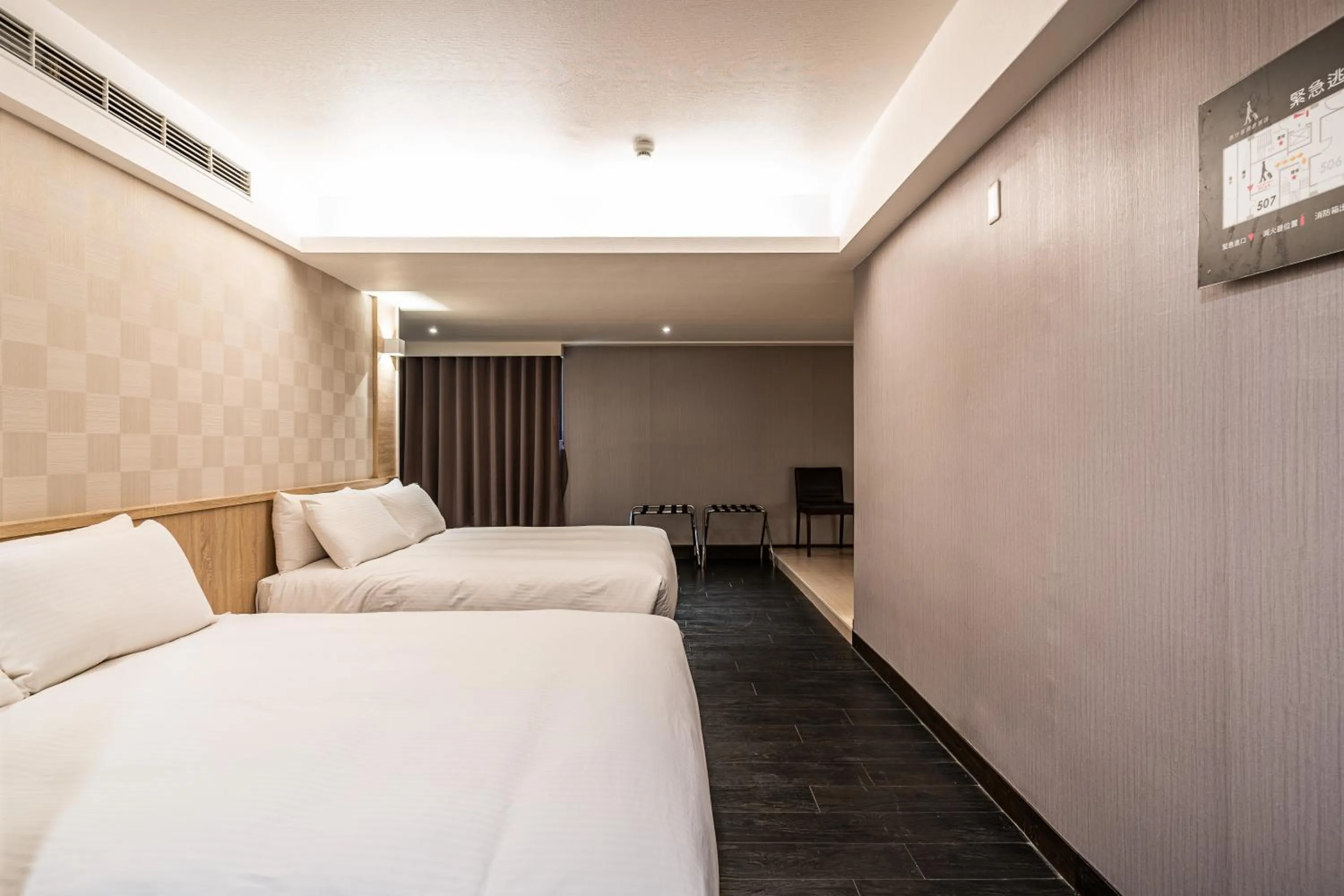 Bed in Global Traveler Hotel