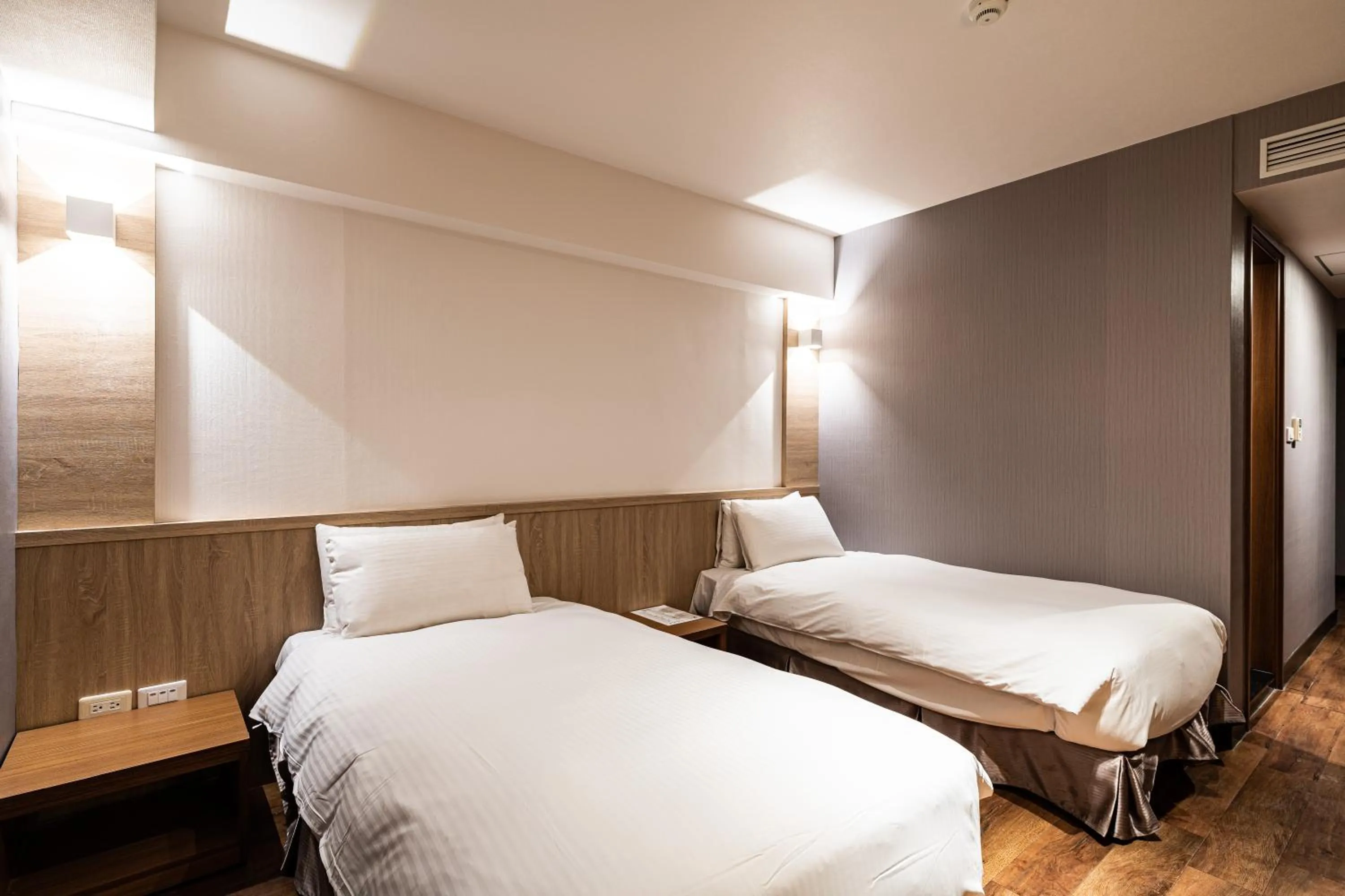 Bed in Global Traveler Hotel