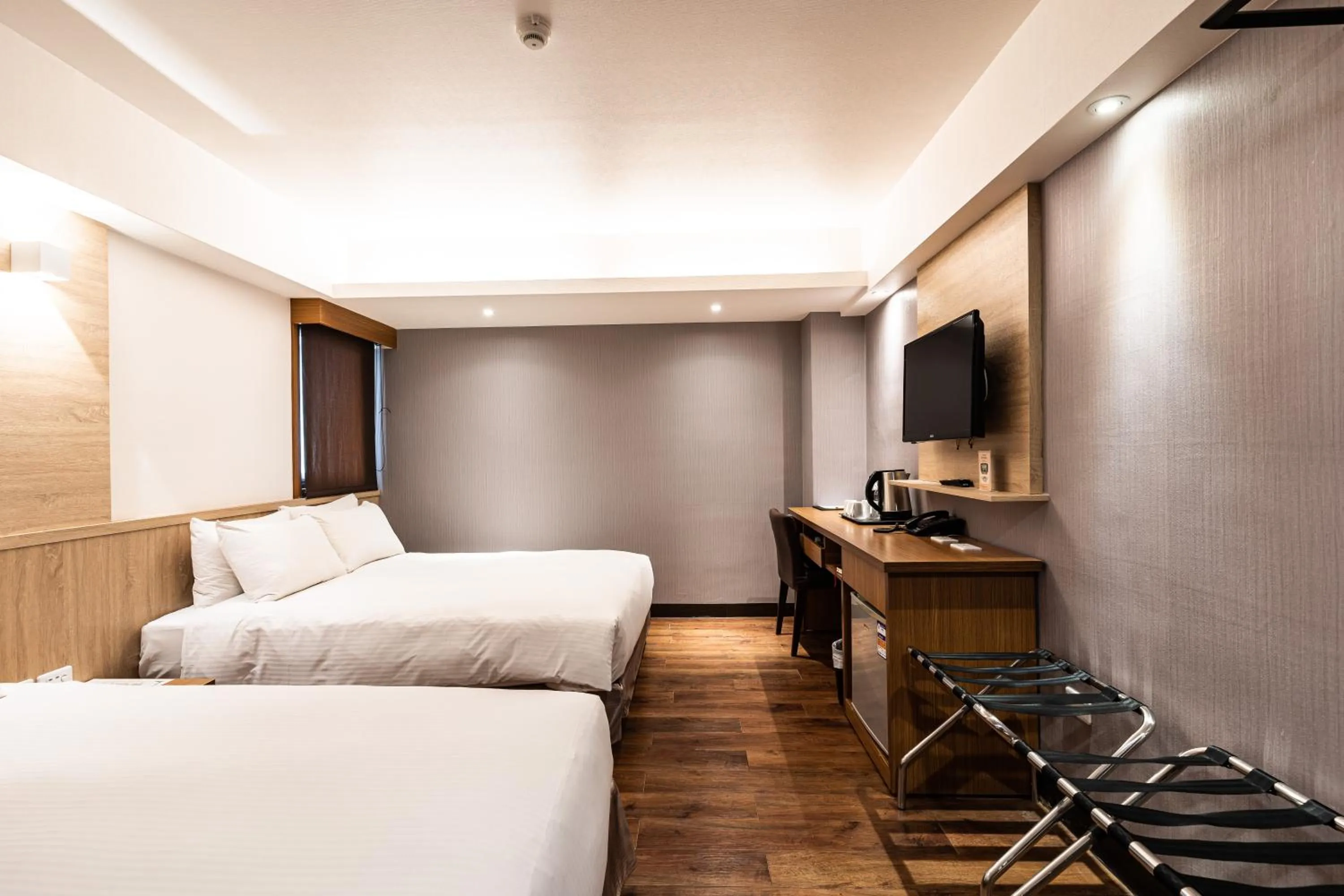 Bed in Global Traveler Hotel